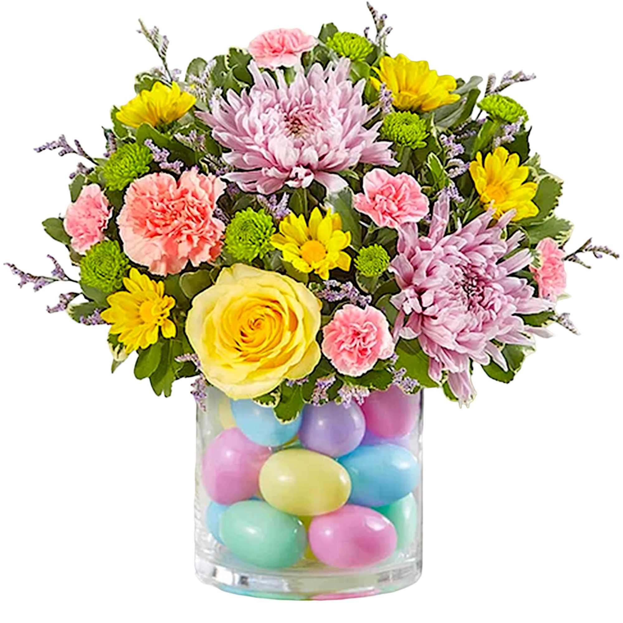Mixed bouquet in a clear vase filled with pastel eggs