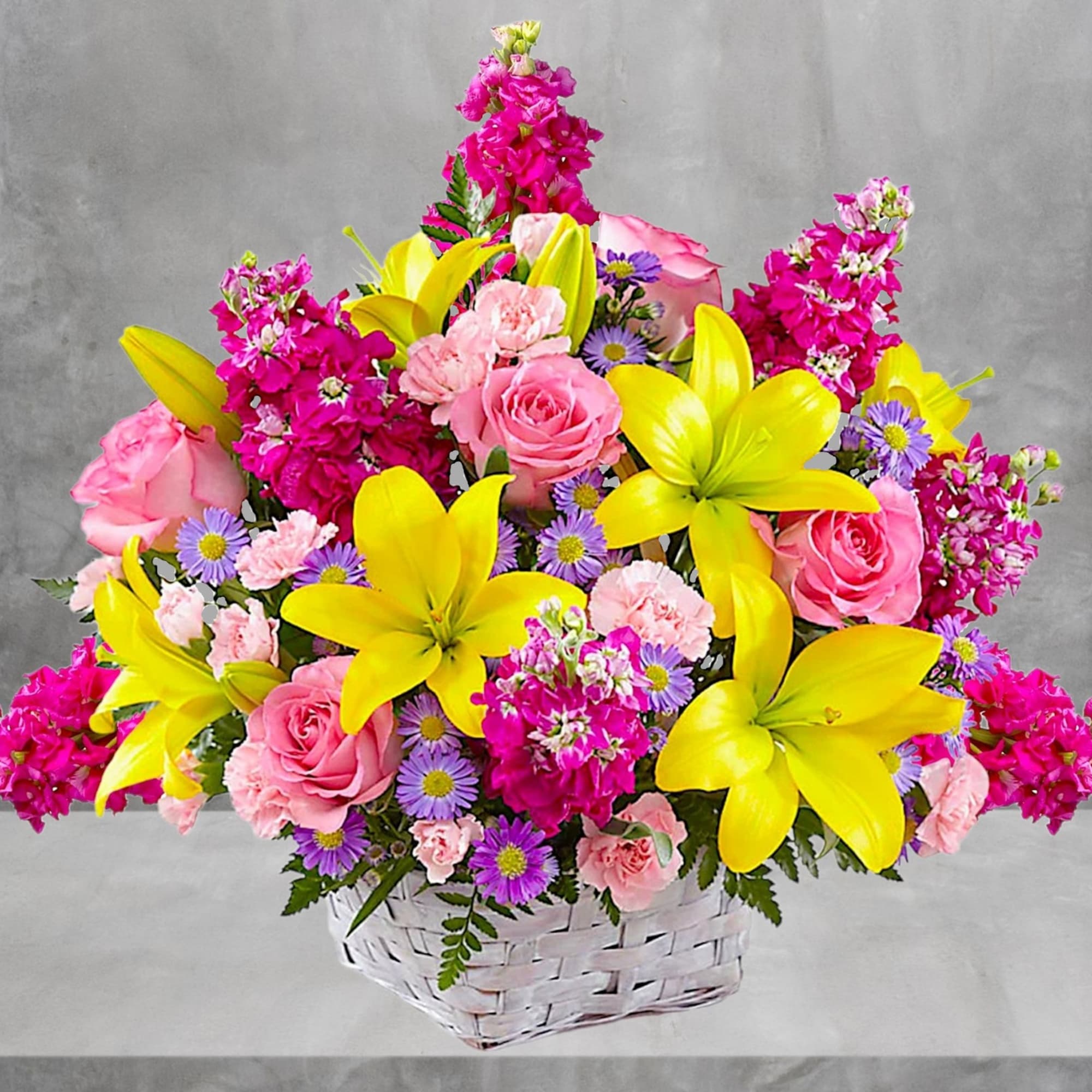 Basket arrangement of pink roses, yellow lilies, and purple daisies, photo 2 of 4
