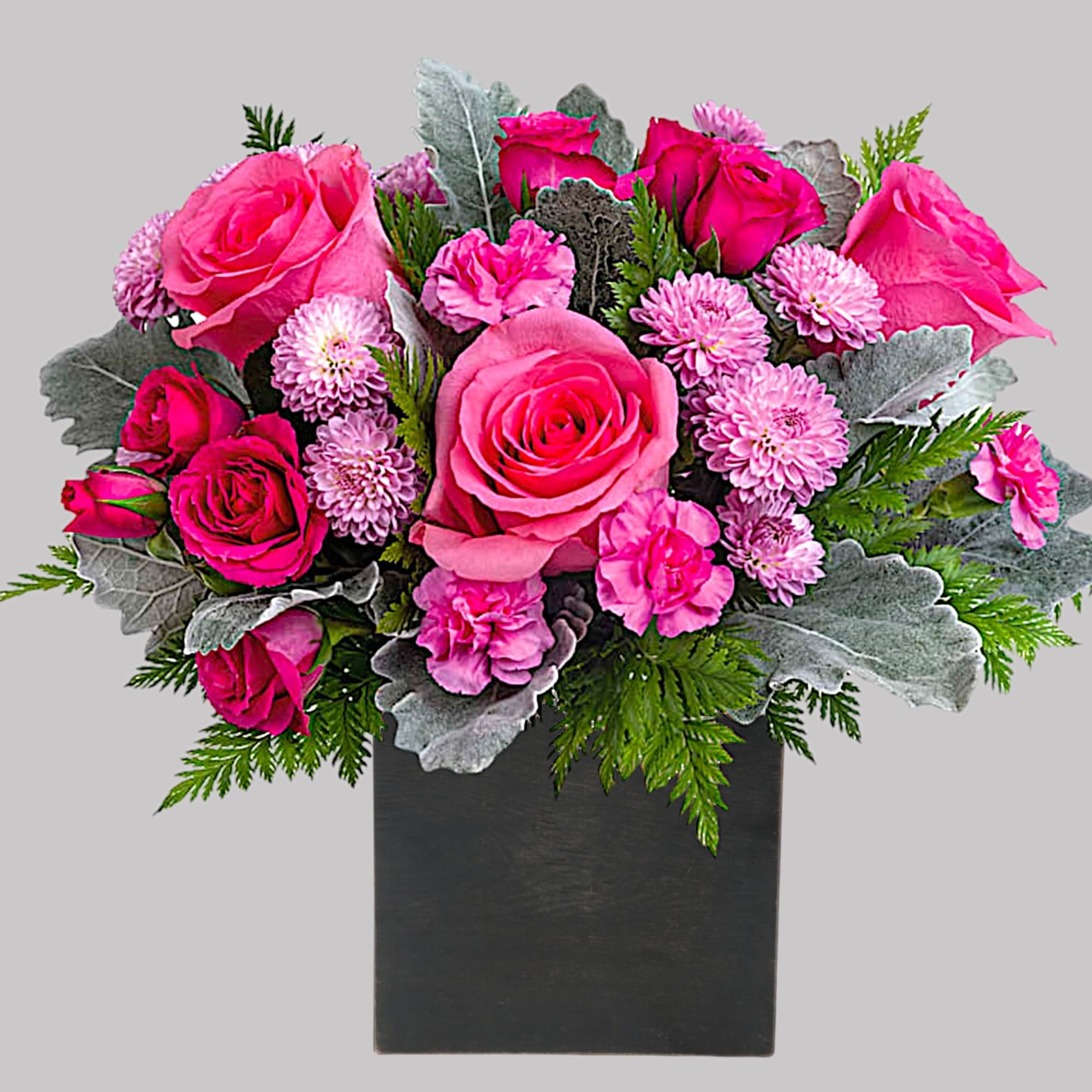 Pink roses and small pink blooms in a black vase