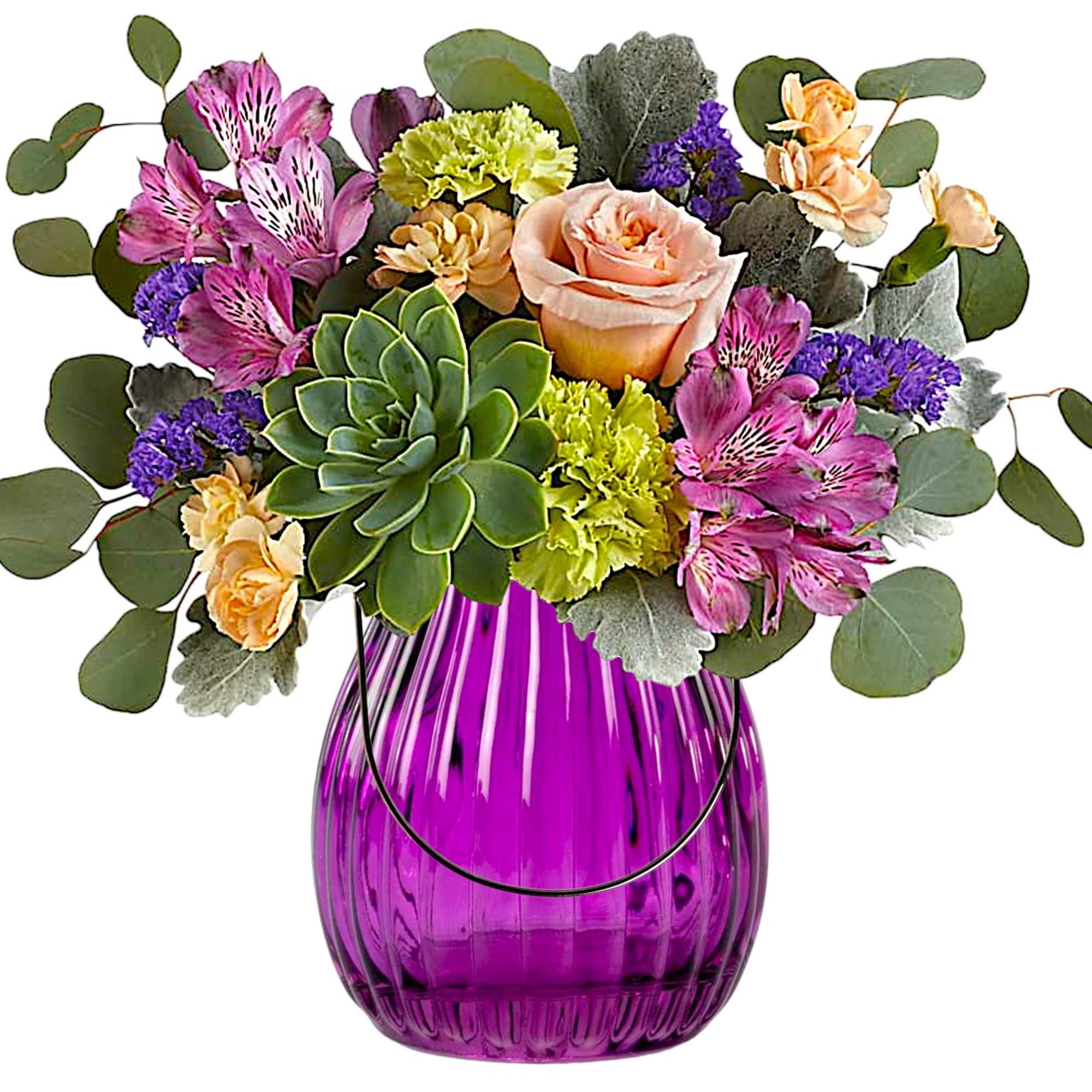 Mixed bouquet in a purple glass vase with a succulent centerpiece