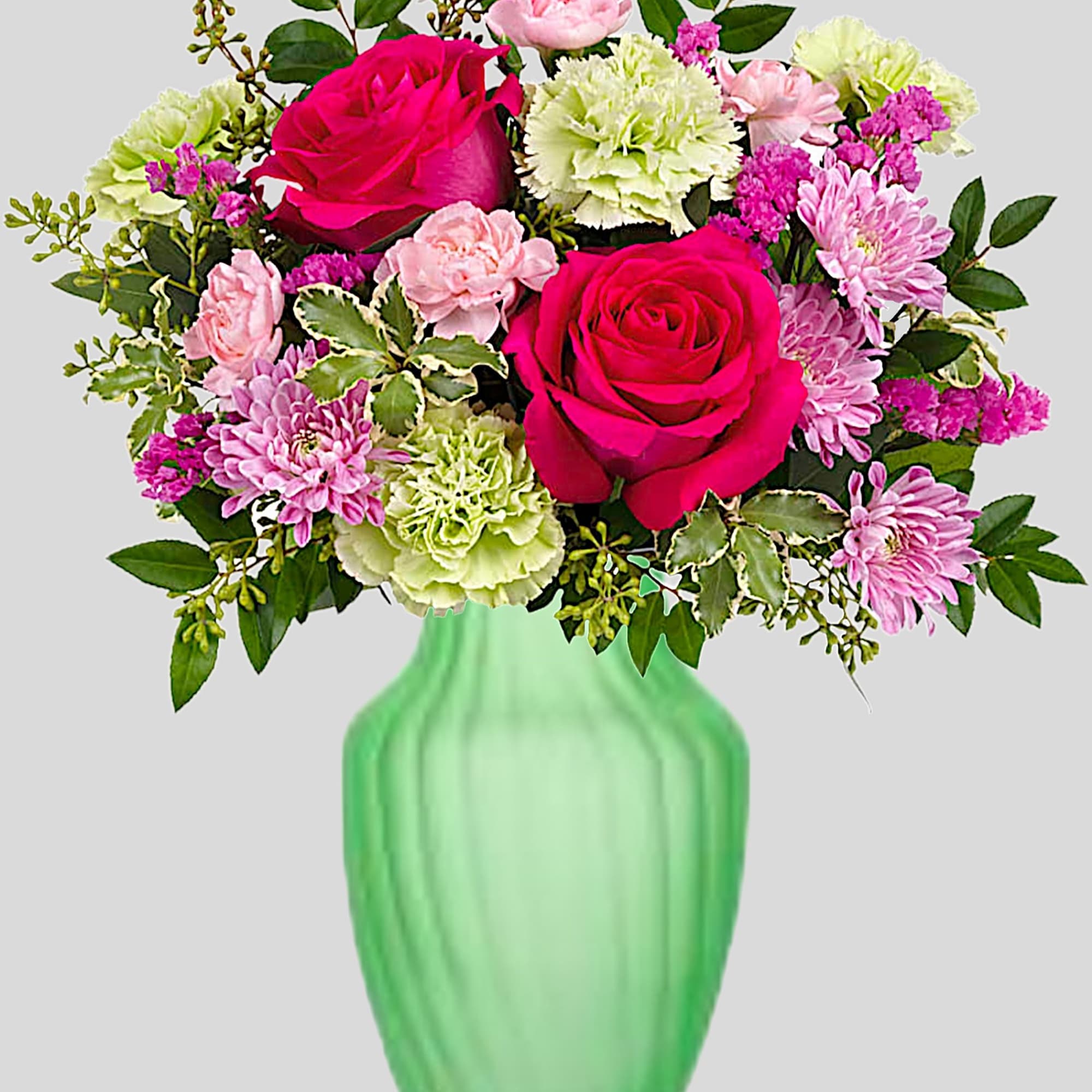 Bouquet of pink roses and carnations in a green vase