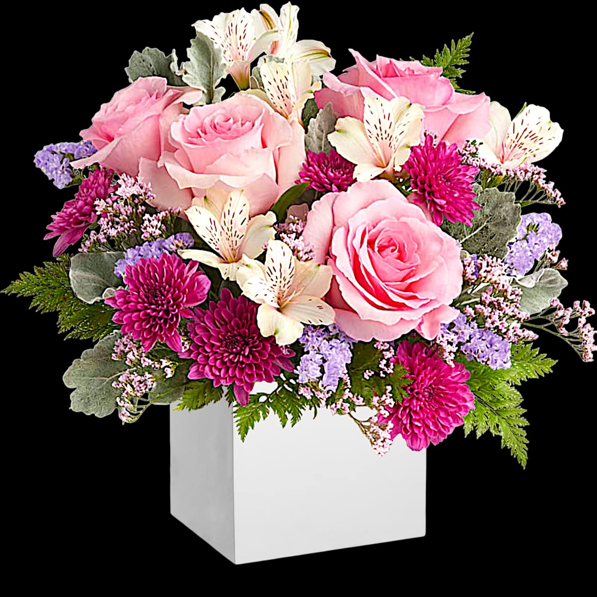 Pink roses and magenta flowers in a white square vase