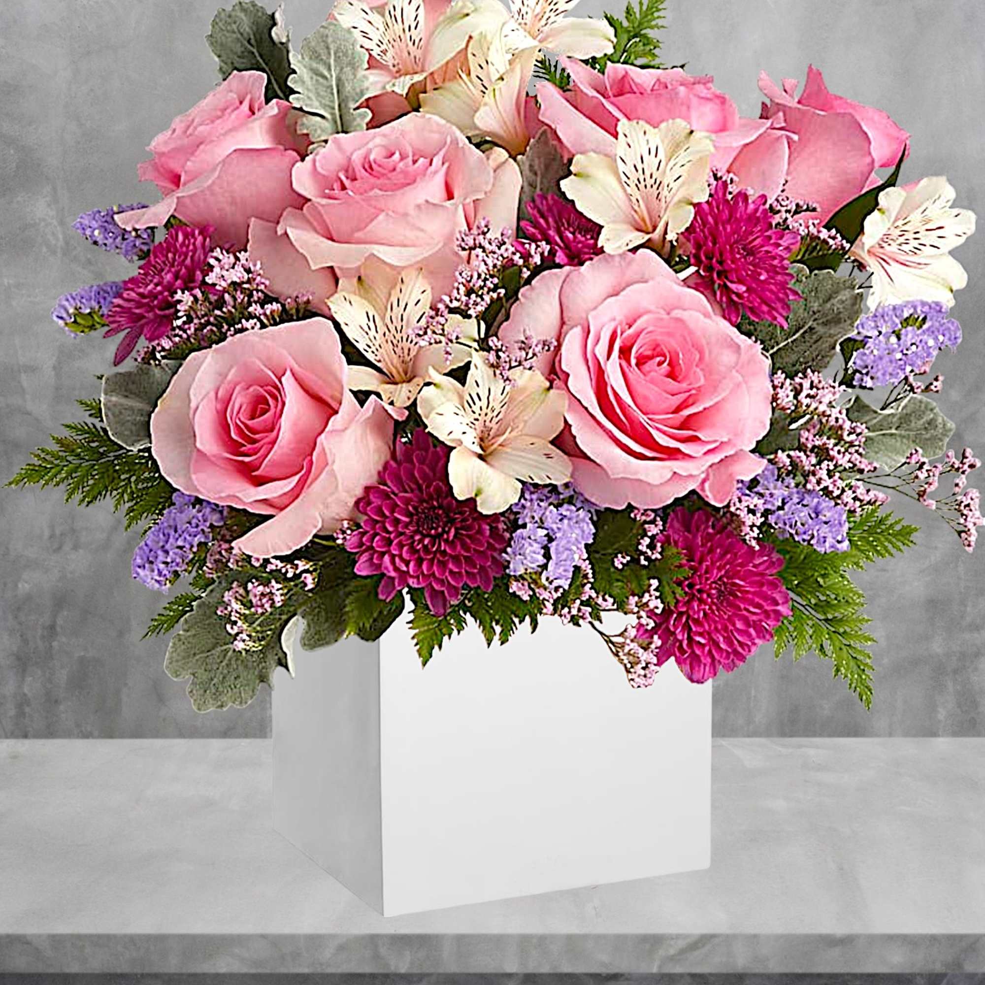 Pink roses and purple flowers arranged in a white box, photo 2 of 4