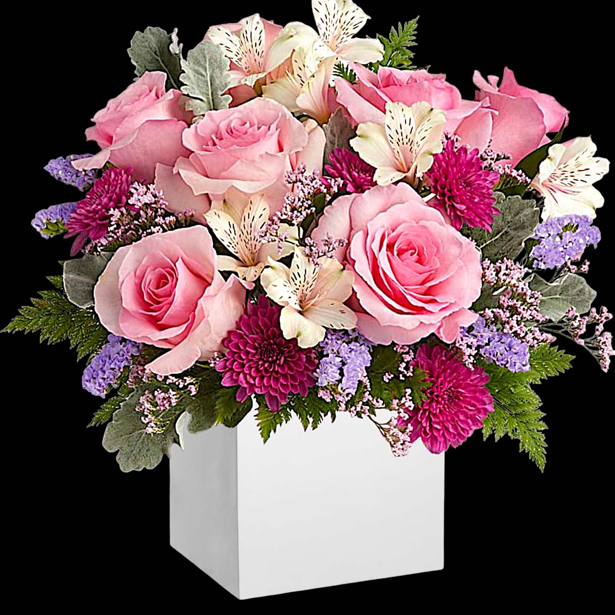 Pink roses and mixed flowers arranged in a white square box