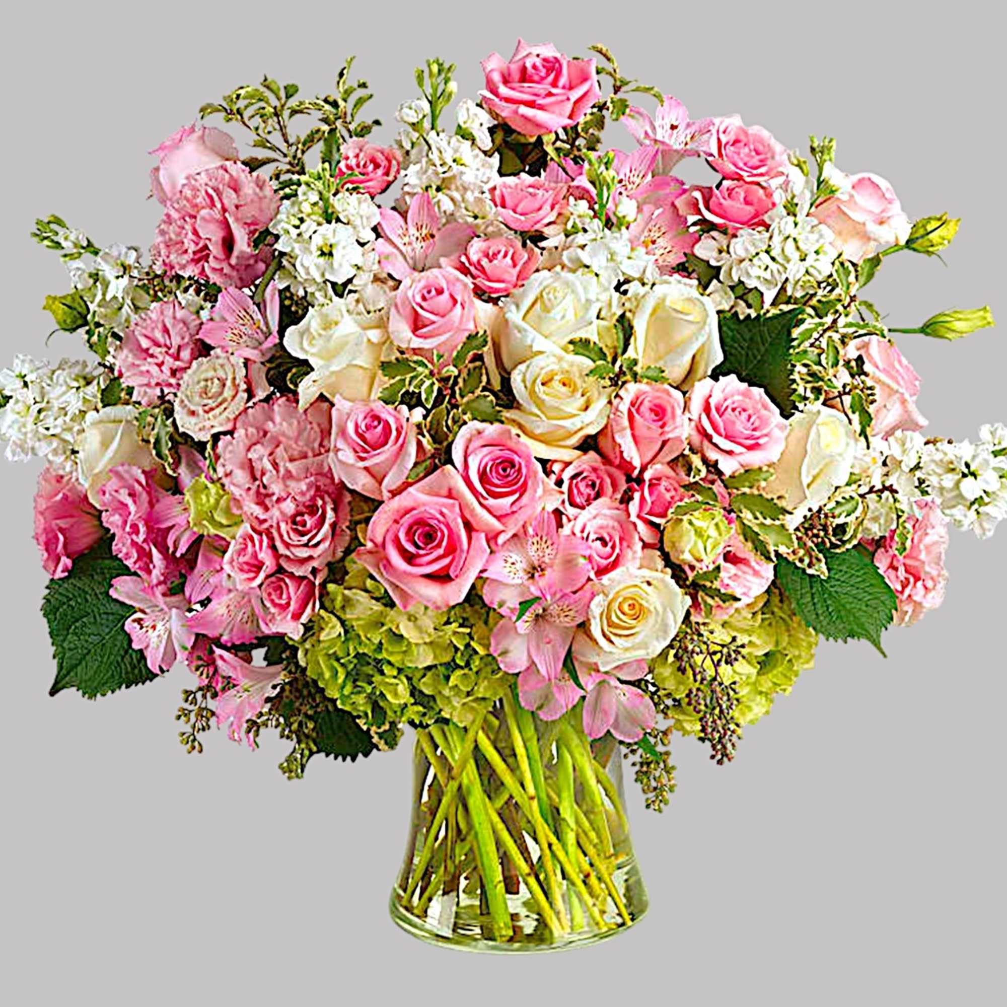 Pink and white rose bouquet in a clear glass vase, photo 5 of 5