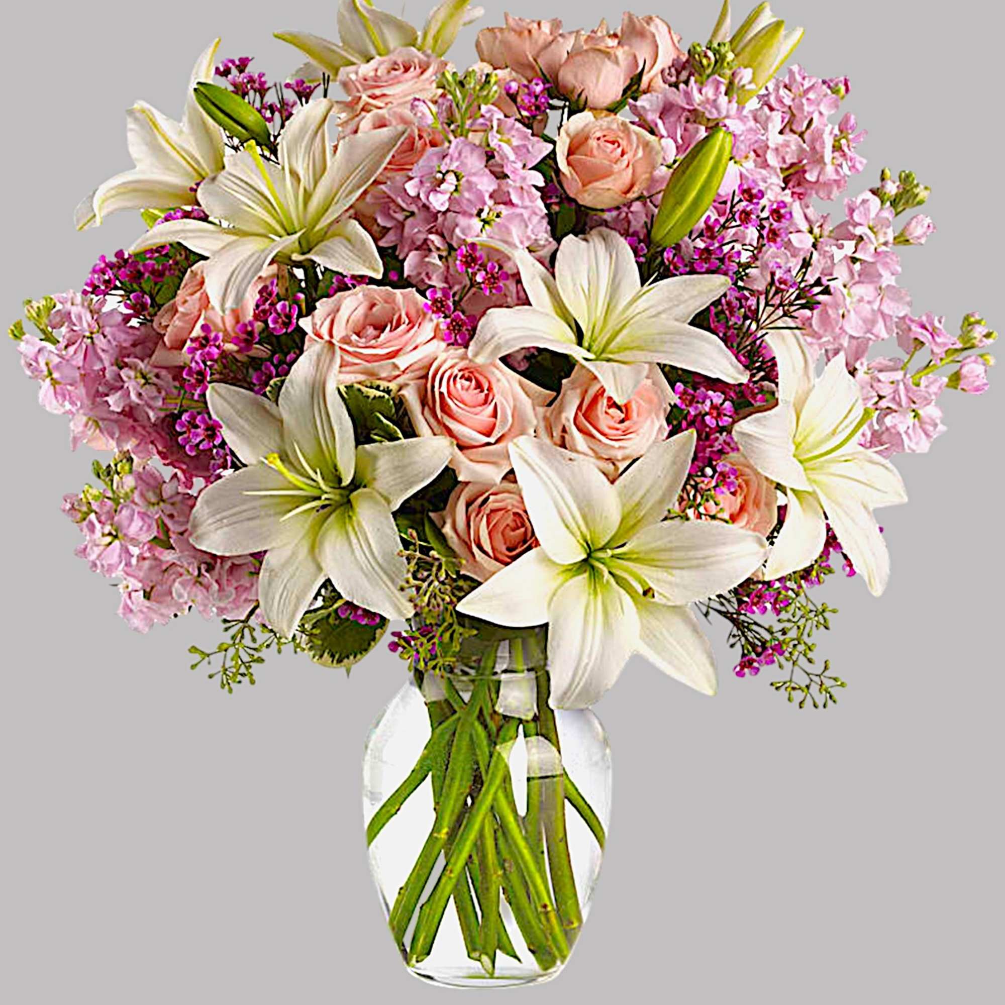 Pink roses and white lilies in a clear glass vase, photo 4 of 4