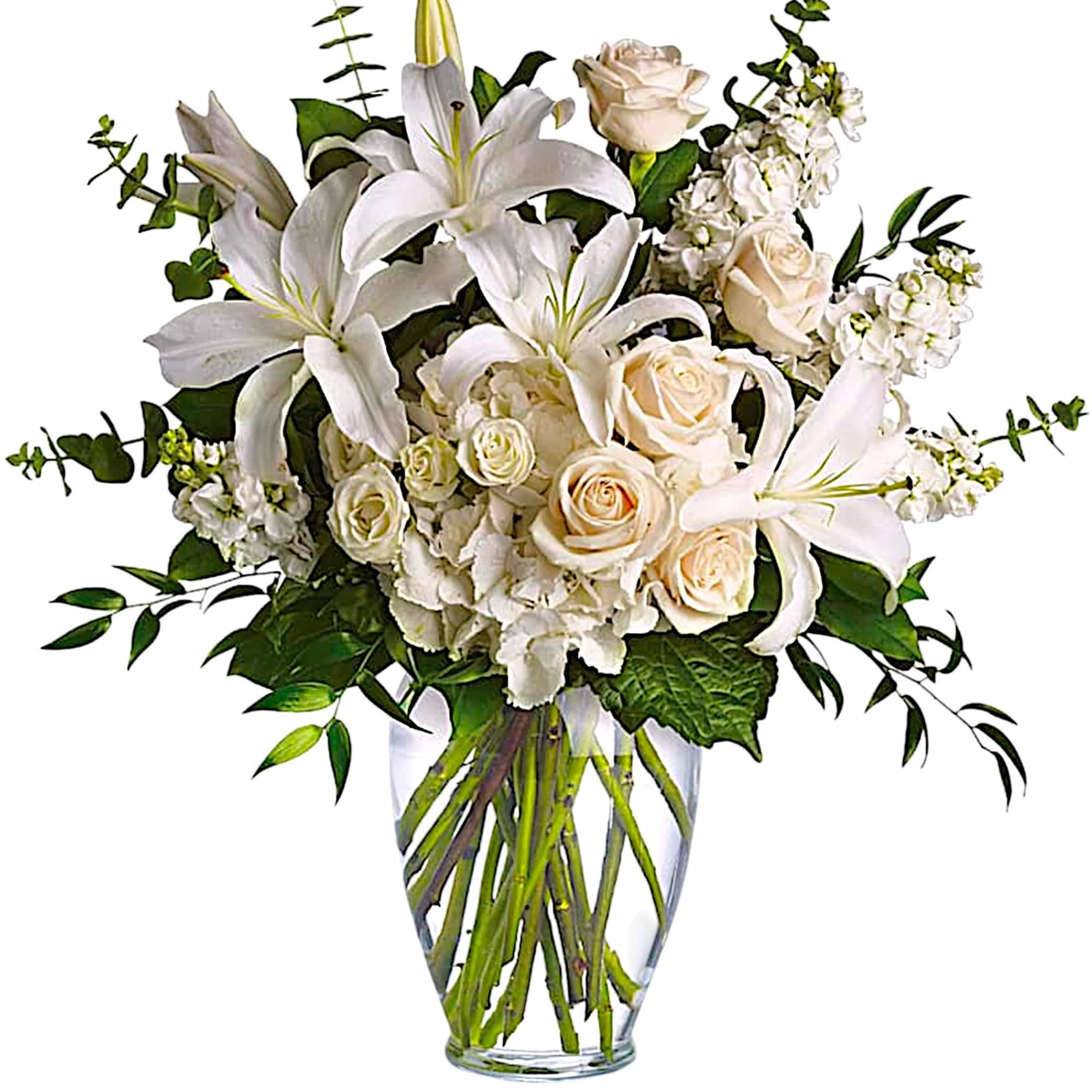 White lilies and cream roses in a clear glass vase