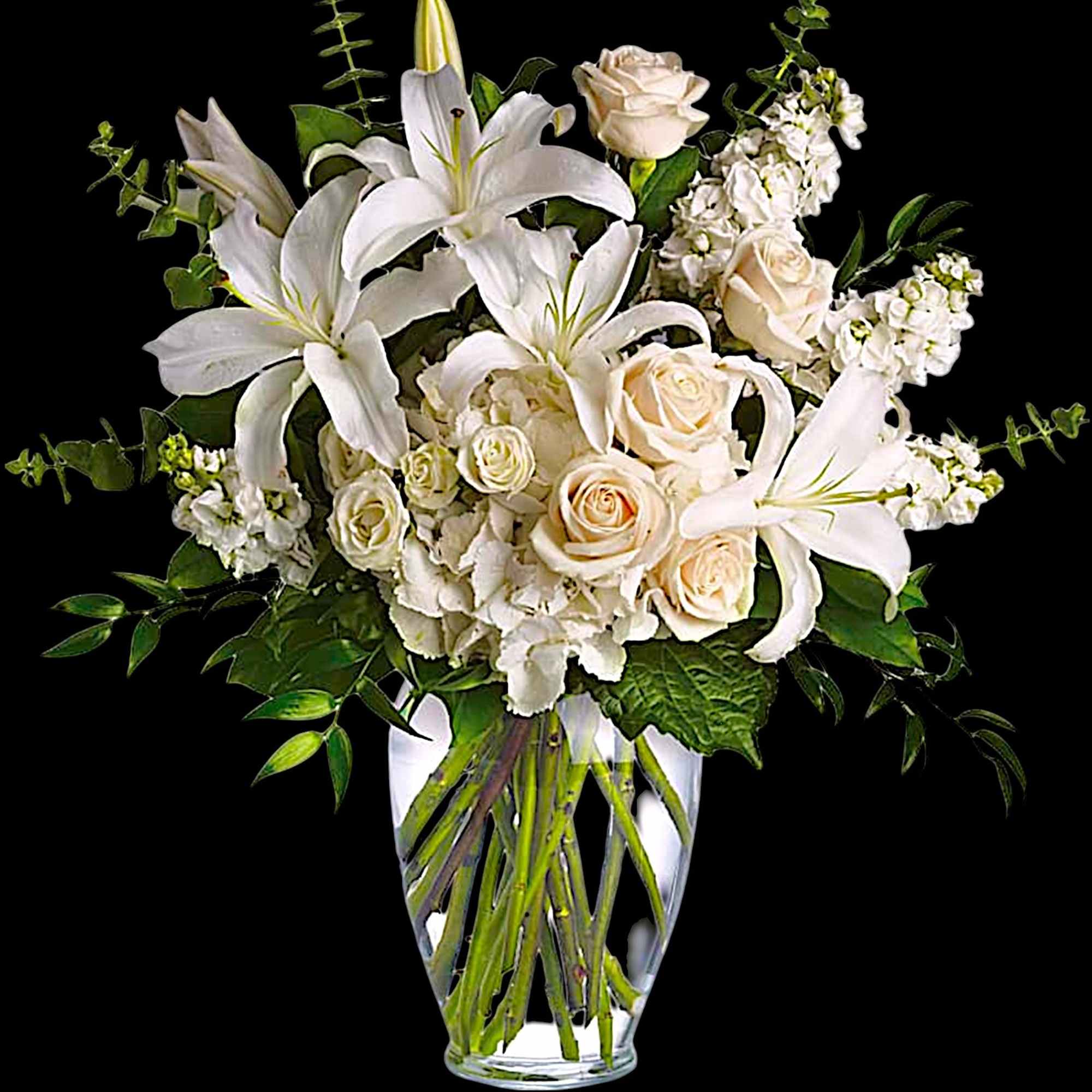 White lilies and cream roses arranged in a clear glass vase, photo 4 of 5