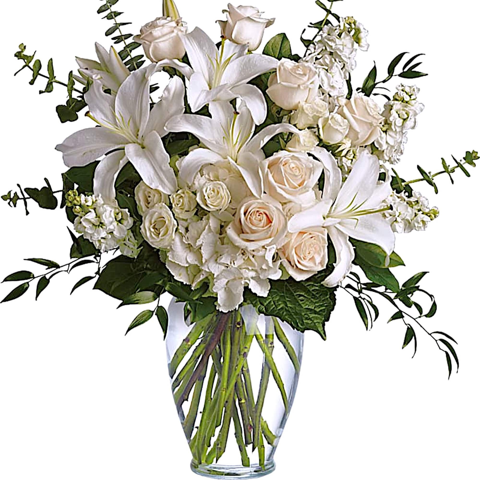 White lilies and roses arranged in a clear glass vase