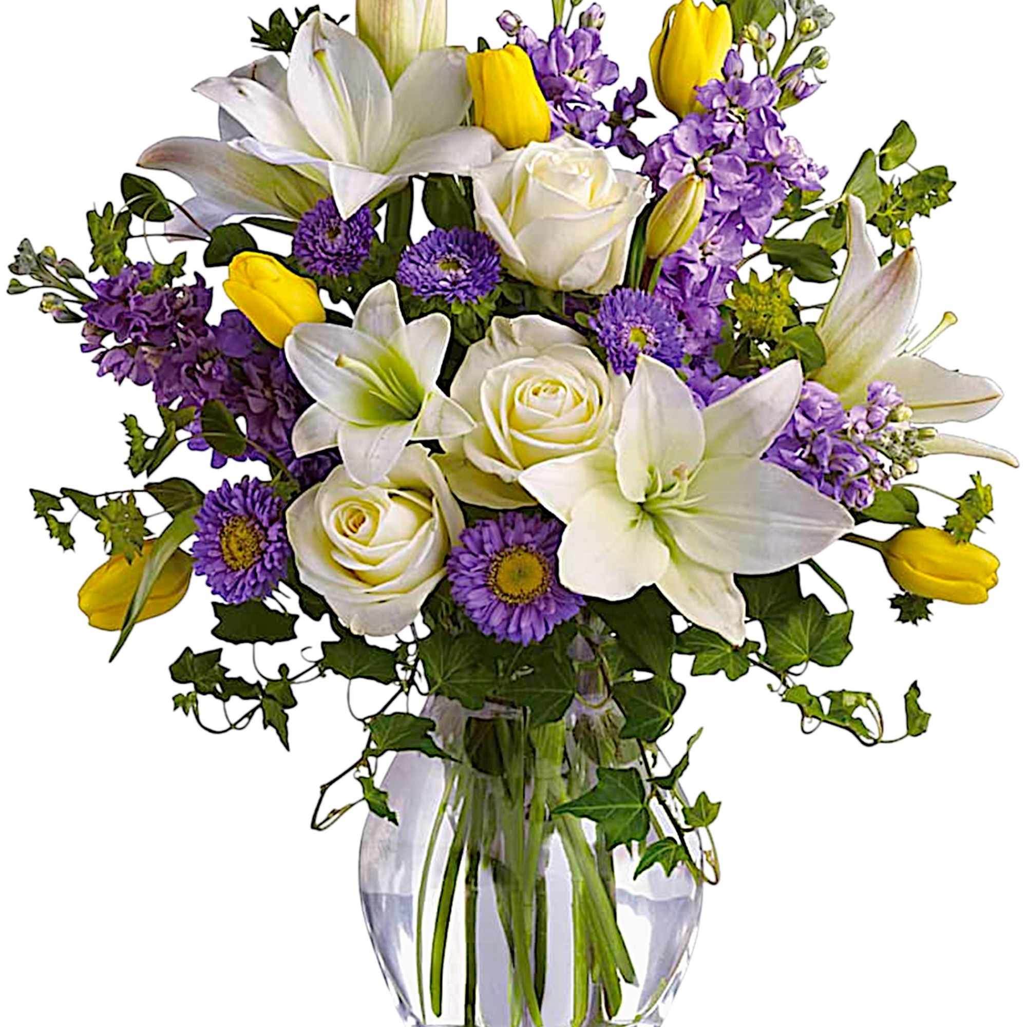 Bouquet of white lilies, roses, purple flowers, and yellow tulips in a glass vase