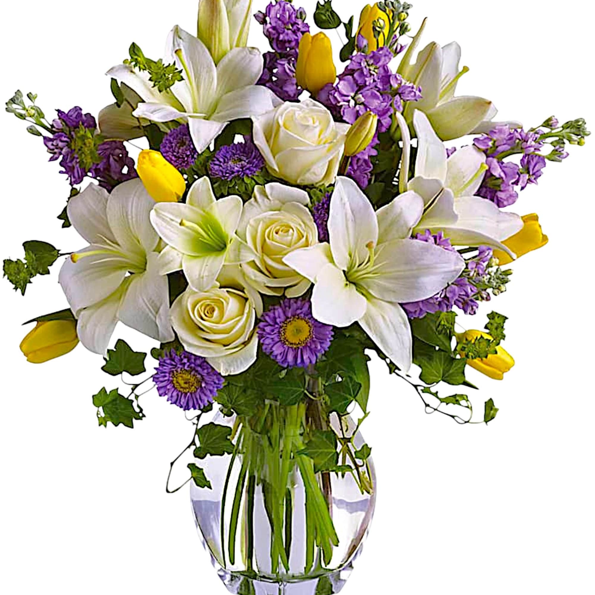 Bouquet of white lilies, cream roses, and purple flowers in a glass vase