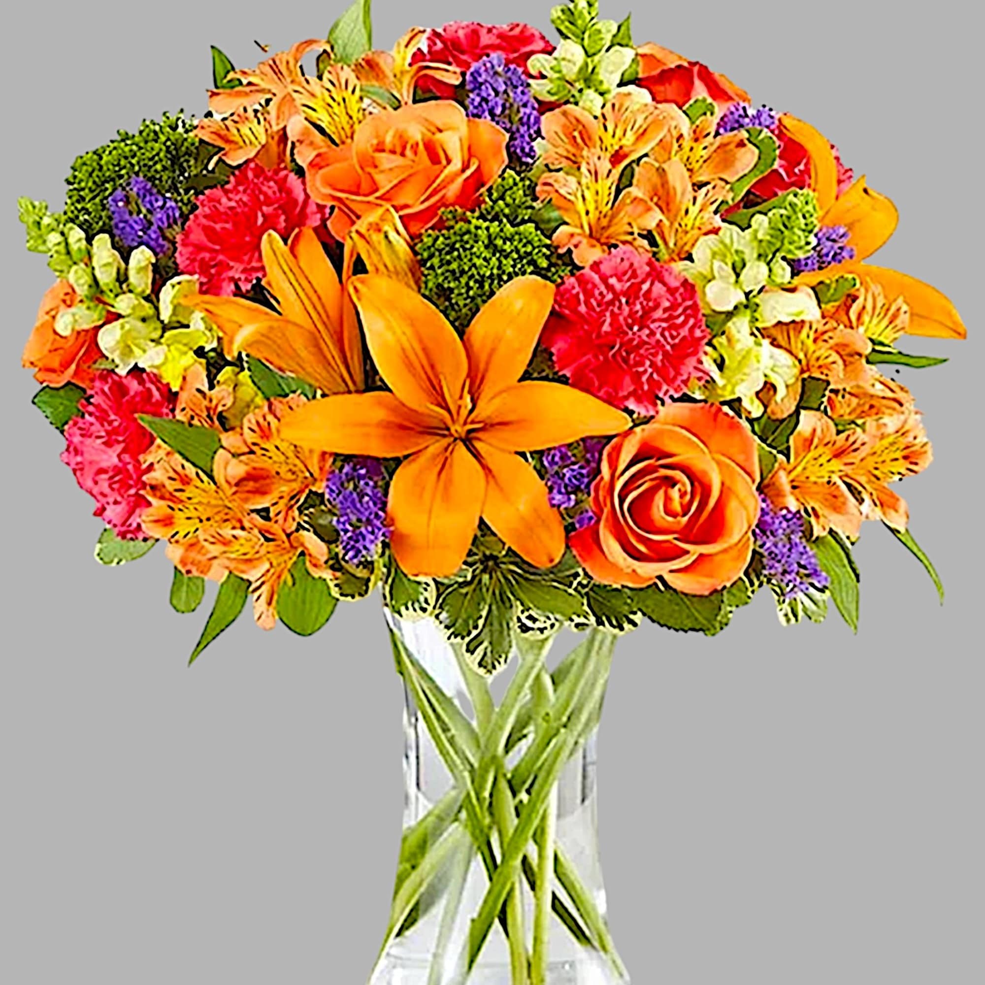 Orange and pink mixed bouquet in a clear glass vase, photo 5 of 5