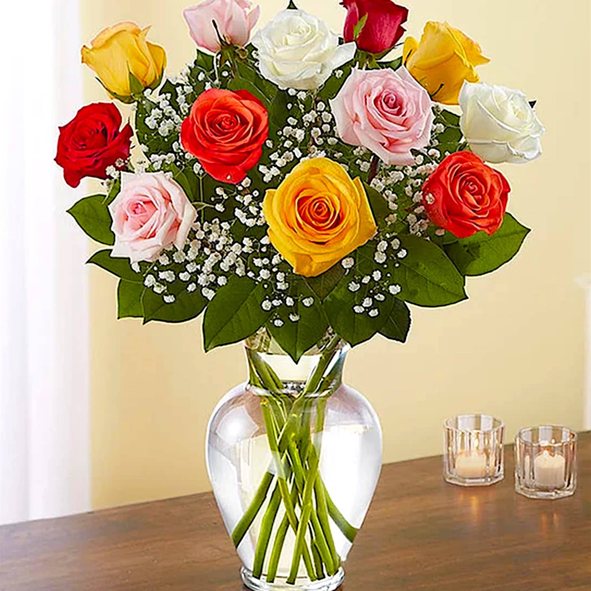 Mixed roses in a clear glass vase with baby's breath, photo 2 of 5