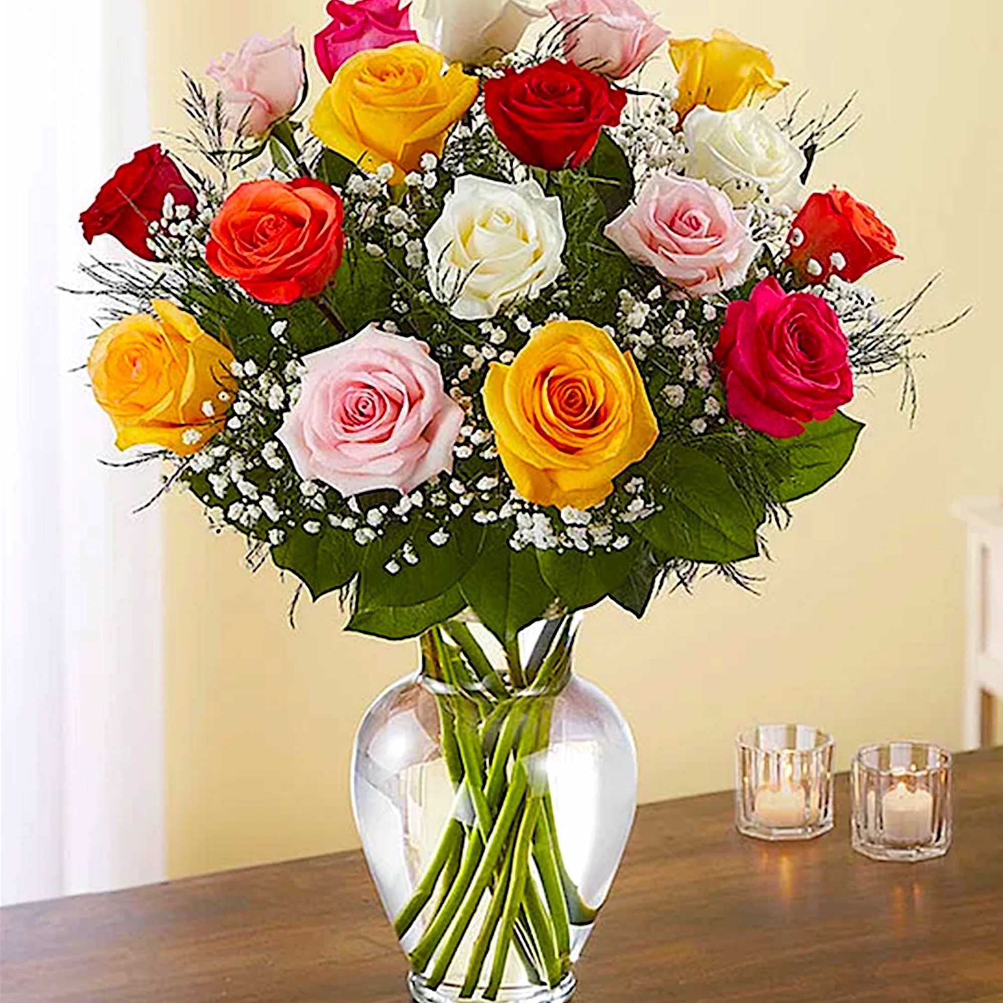 Bouquet of multicolored roses in a clear glass vase, photo 2 of 5