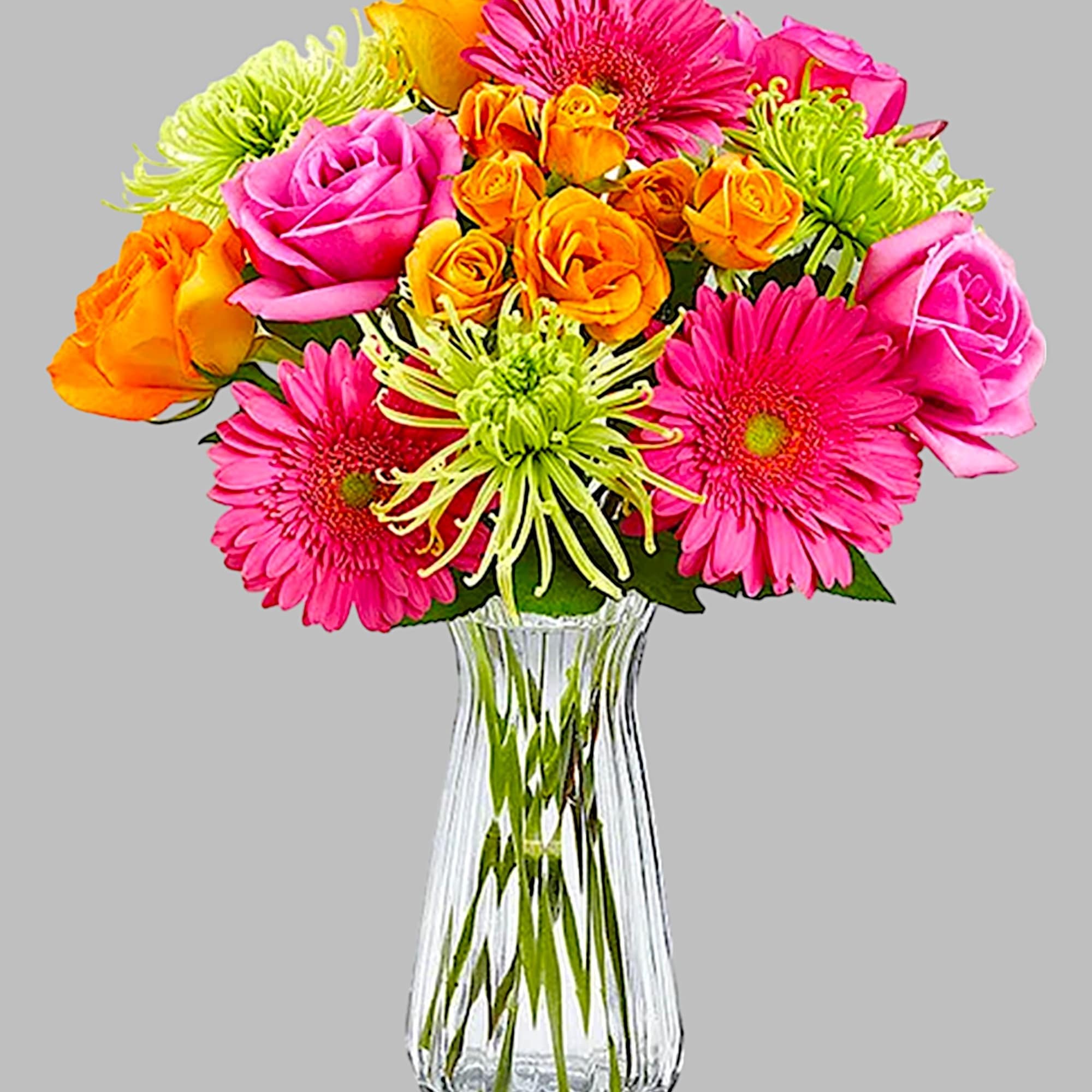 Pink and orange mixed bouquet in a clear glass vase, photo 5 of 5