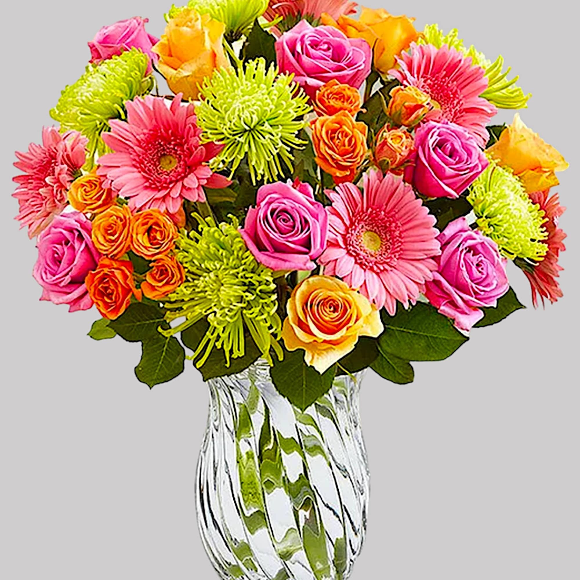 Colorful bouquet of roses and gerbera daisies in a clear glass vase, photo 5 of 5