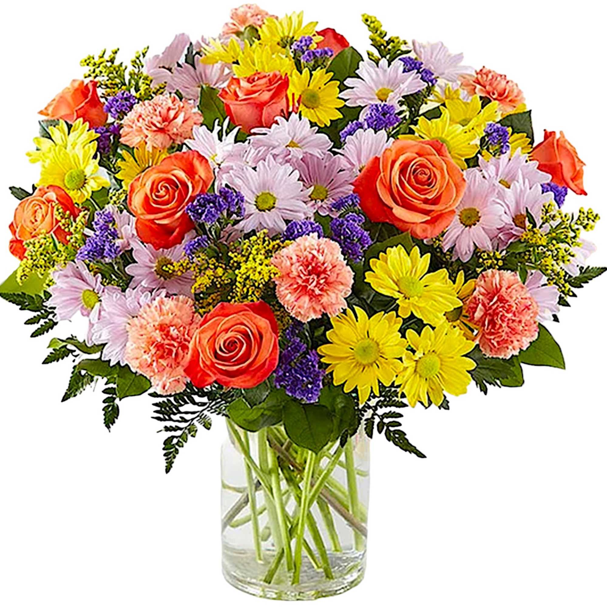 Mixed bouquet of roses, daisies, and carnations in a clear glass vase