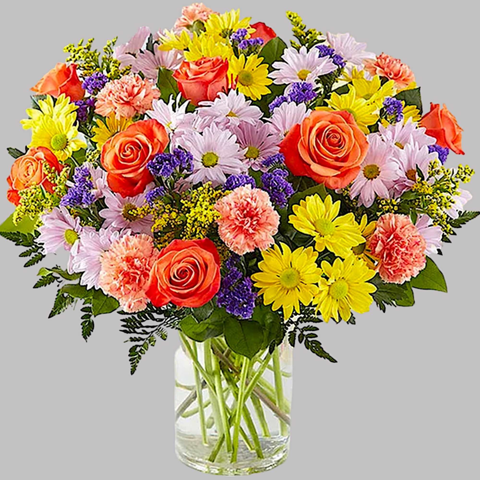 Mixed bouquet of roses, daisies, and carnations in a clear glass vase, photo 5 of 5