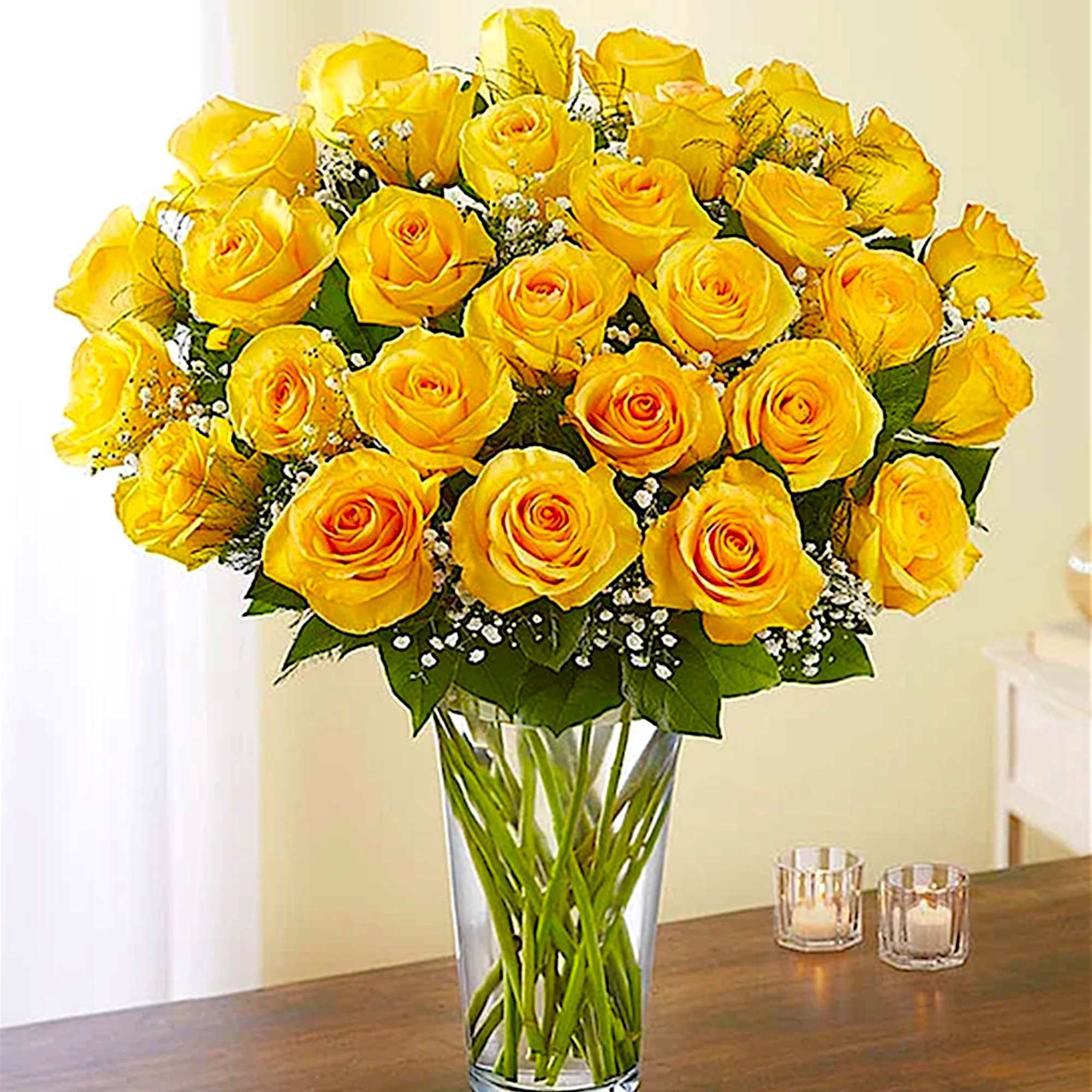 Yellow roses arranged in a clear glass vase, photo 2 of 5