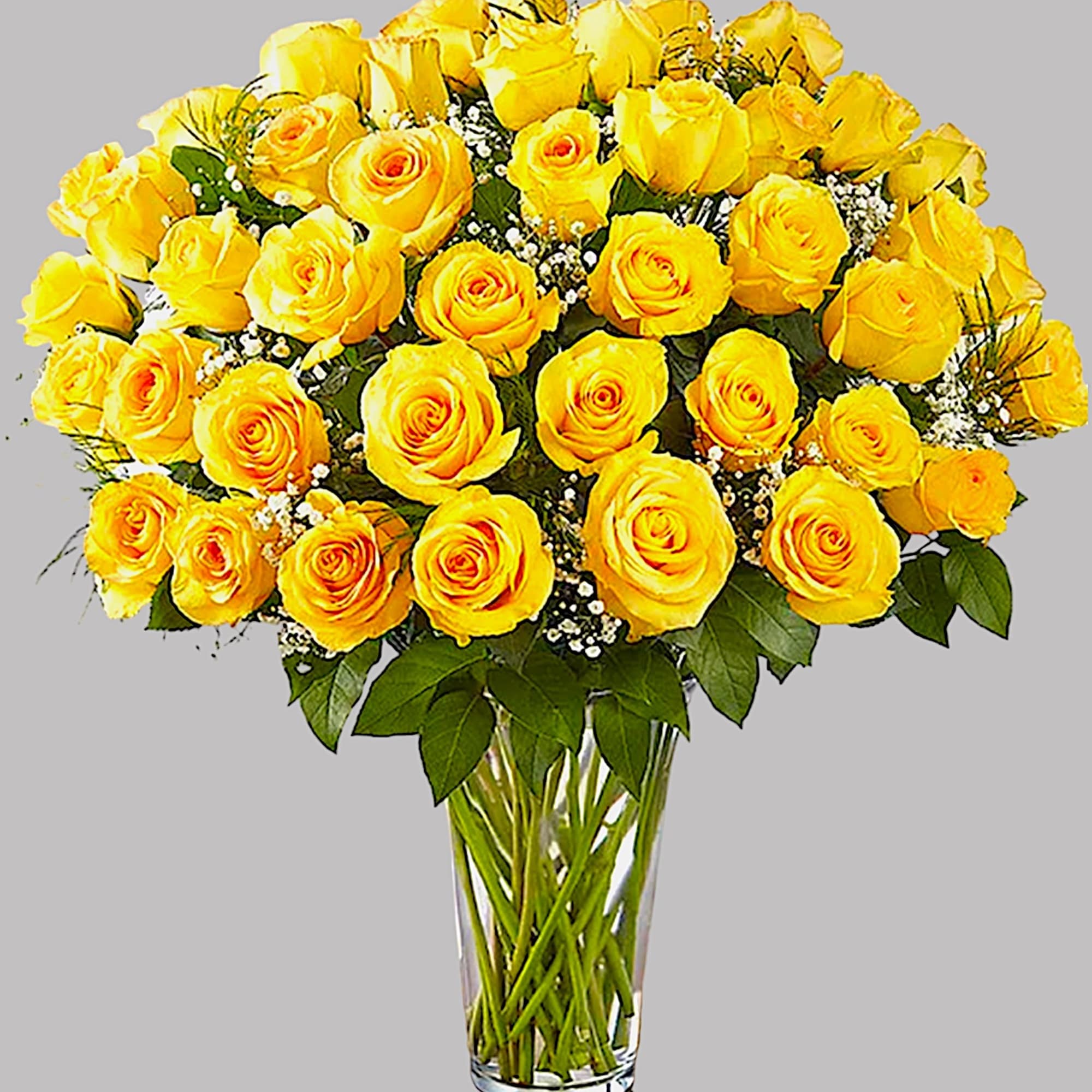 Yellow roses arranged in a clear glass vase, photo 5 of 5
