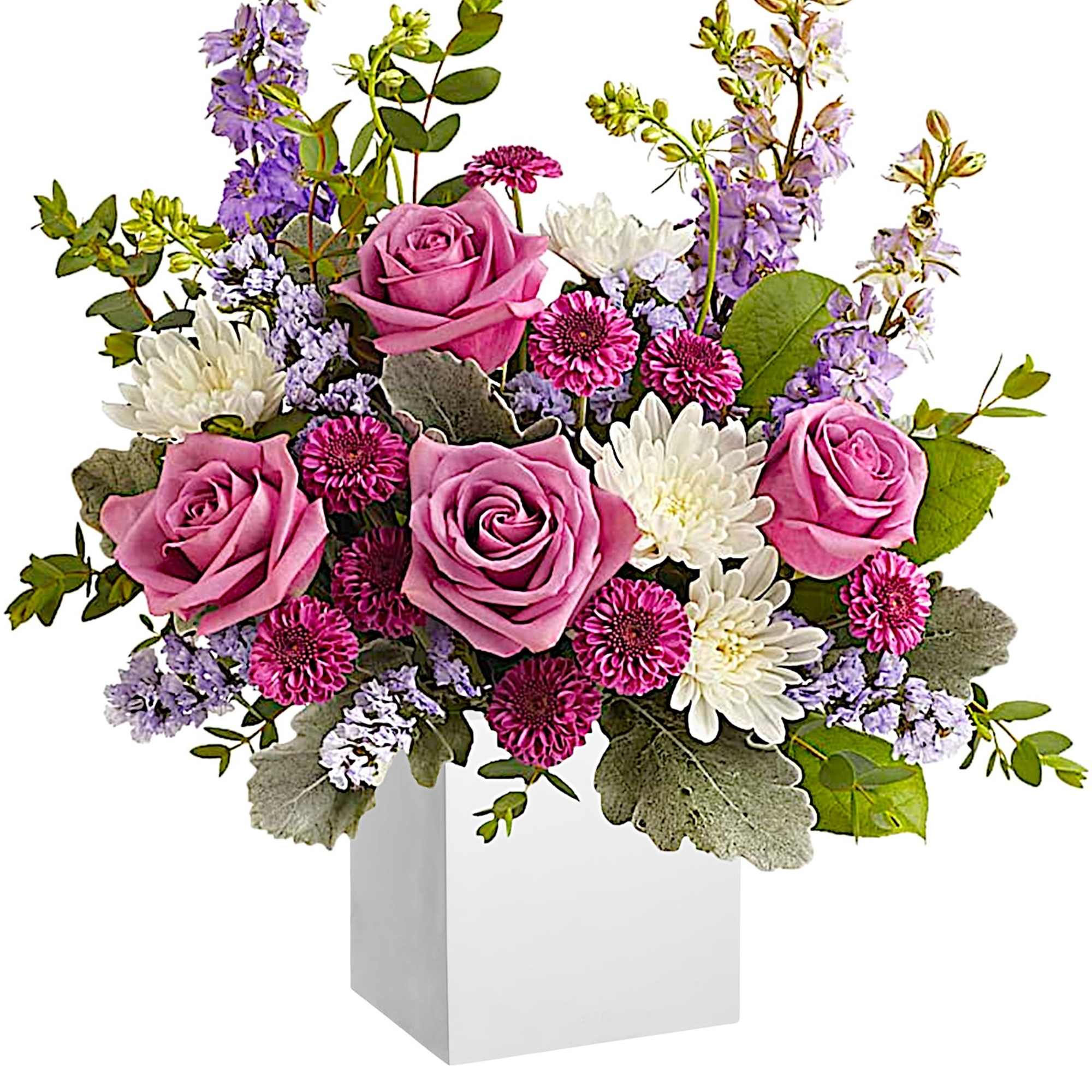 Pink roses and white daisies in a white box vase