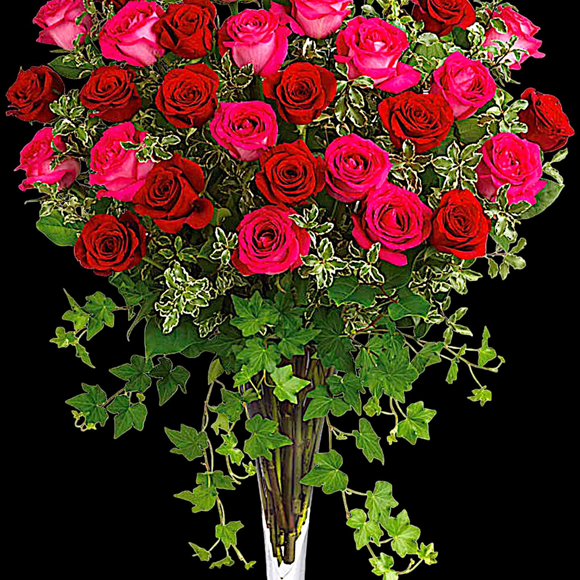Tall bouquet of red and pink roses in a clear glass vase, photo 3 of 4