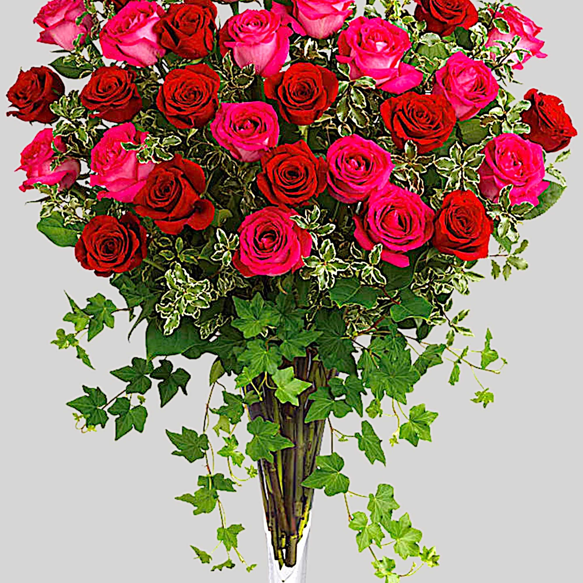 Tall bouquet of red and pink roses in a clear glass vase, photo 4 of 4