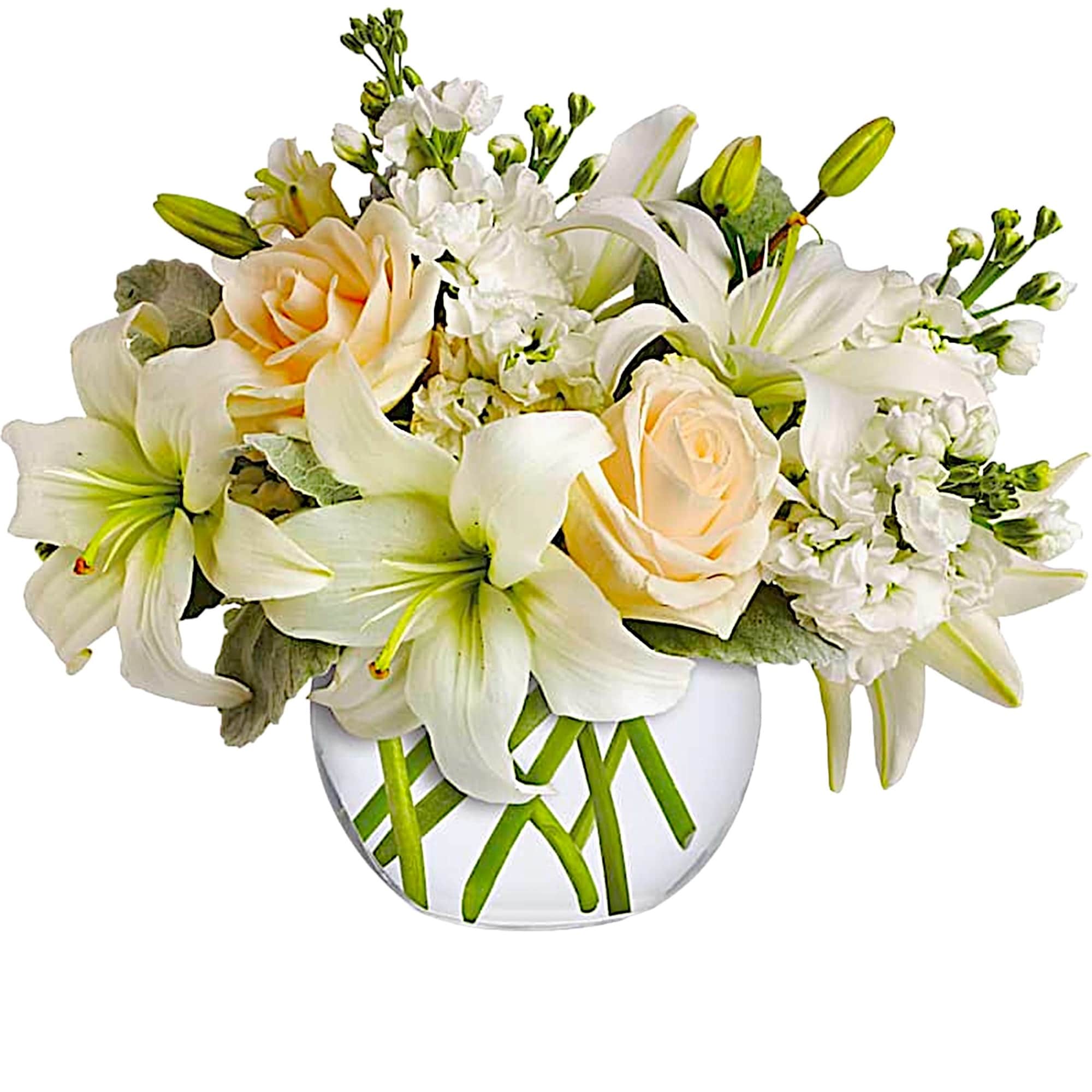 White lilies and pale peach roses in a clear glass vase