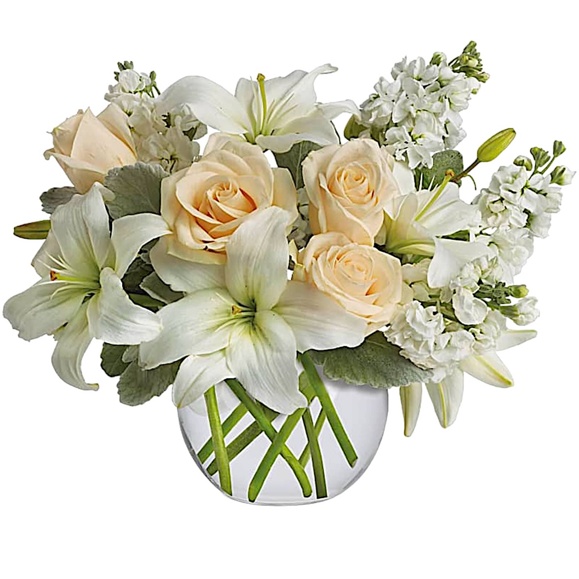 White lilies and pale roses arranged in a clear glass vase