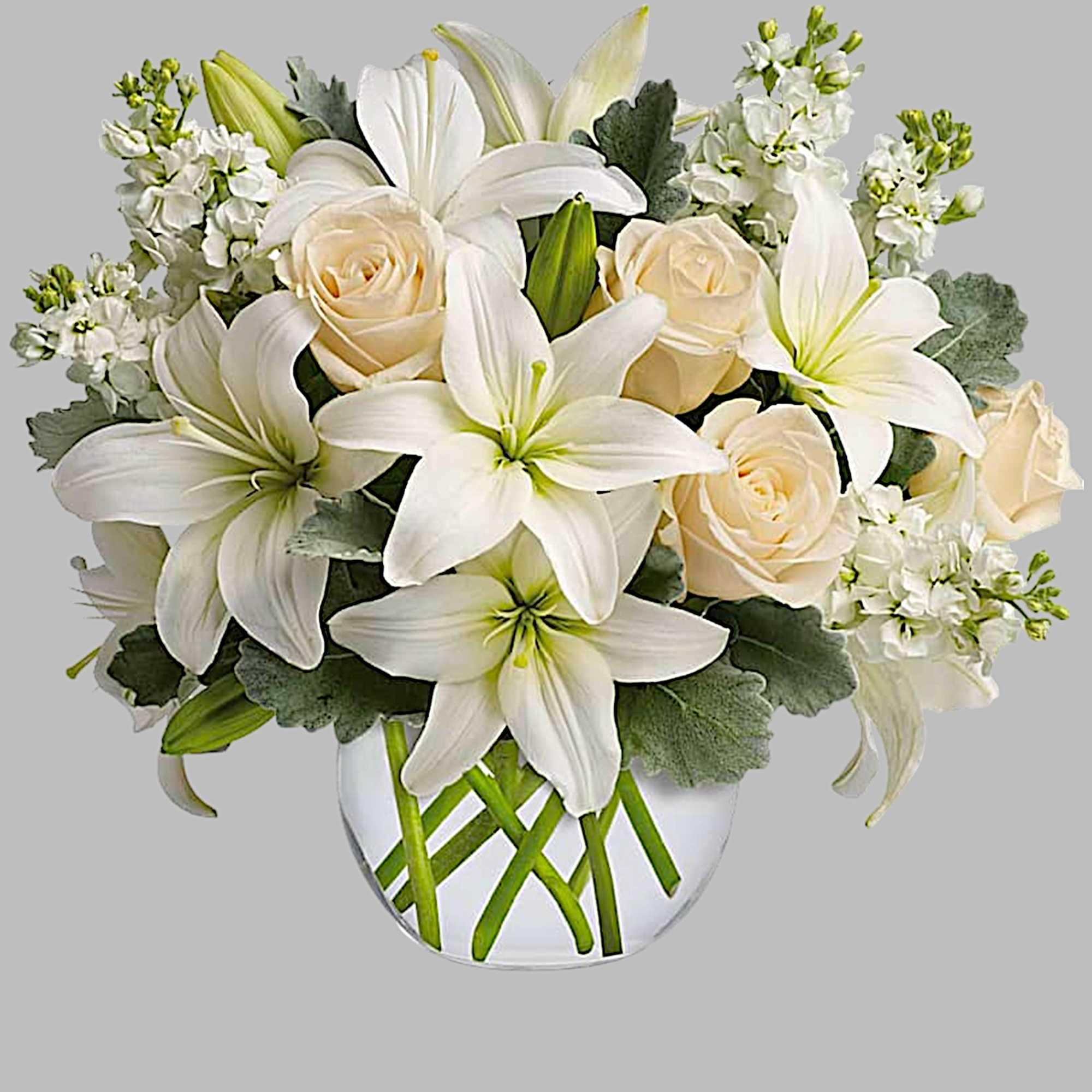 White lilies and cream roses in a clear glass vase, photo 5 of 5
