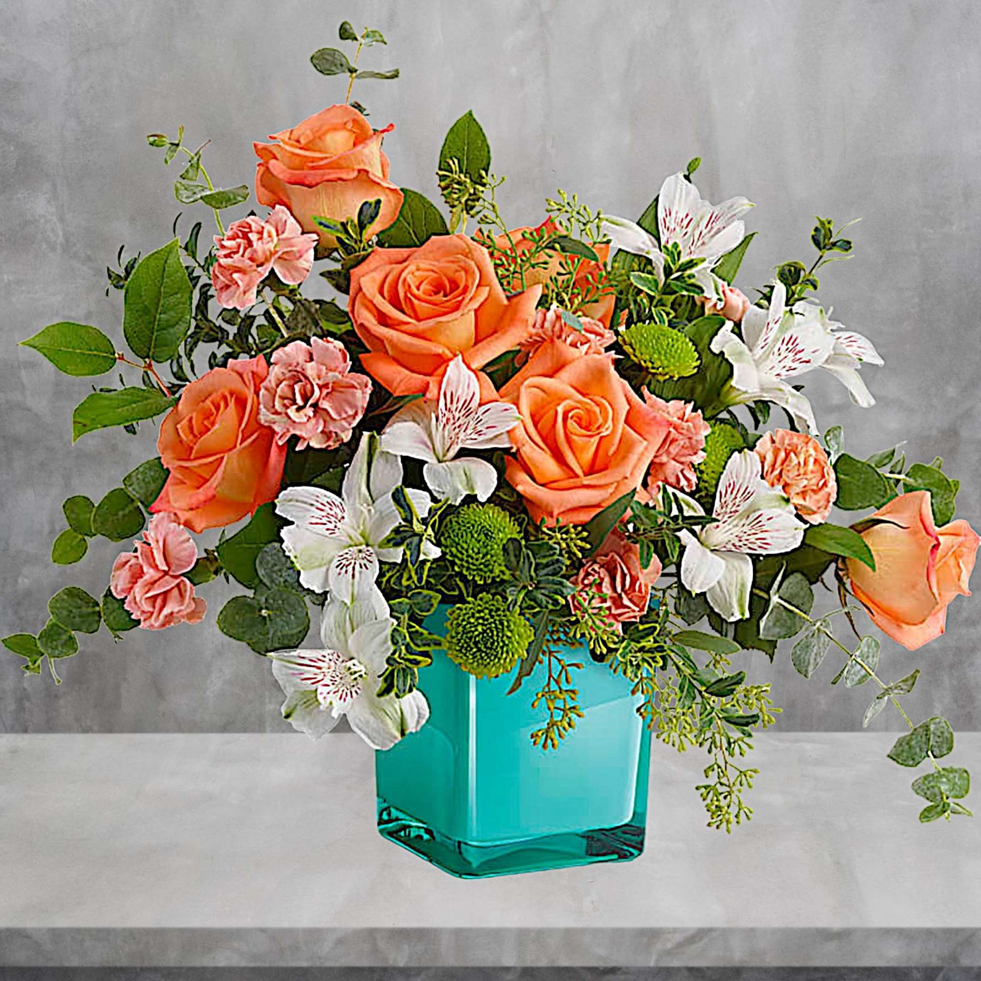 Orange roses and white lilies in a turquoise vase, photo 2 of 4