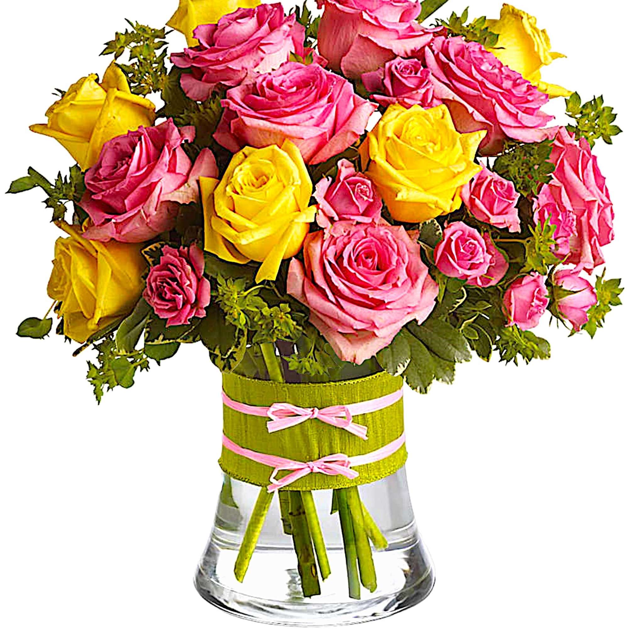 Pink and yellow roses in a clear glass vase with ribbon