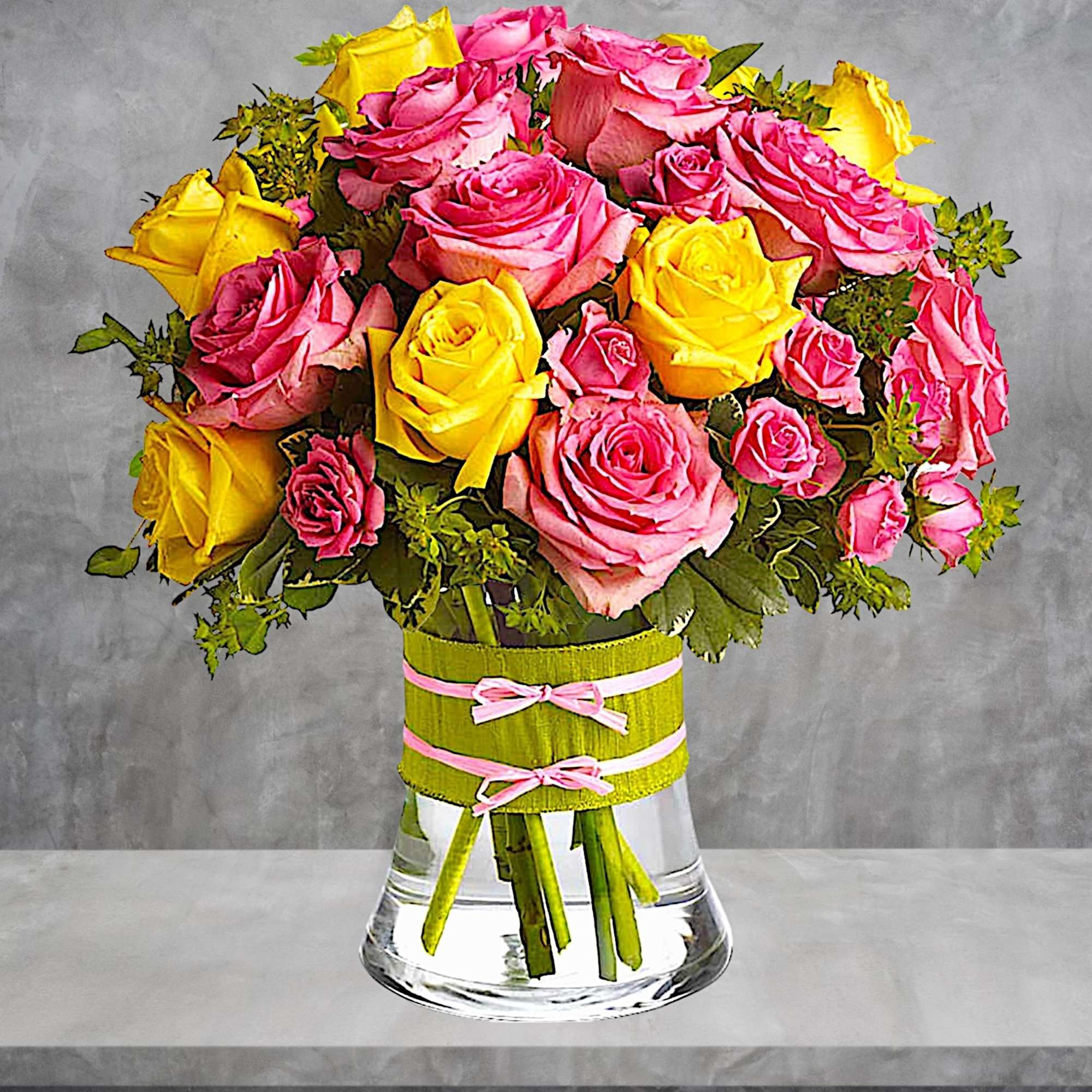 Pink and yellow roses arranged in a clear glass vase with ribbon, photo 3 of 5