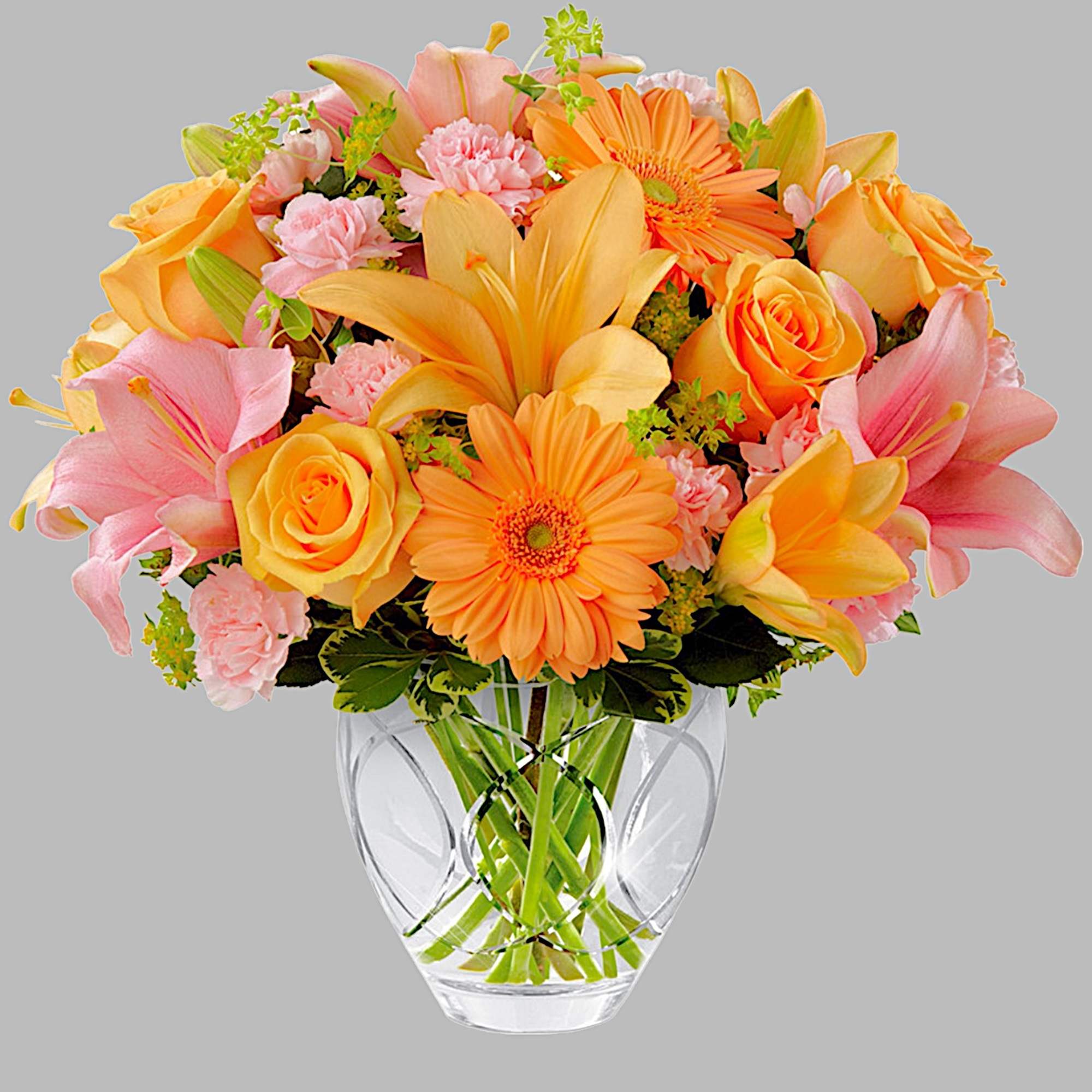 Bouquet of orange and pink flowers in a clear glass vase, photo 4 of 4