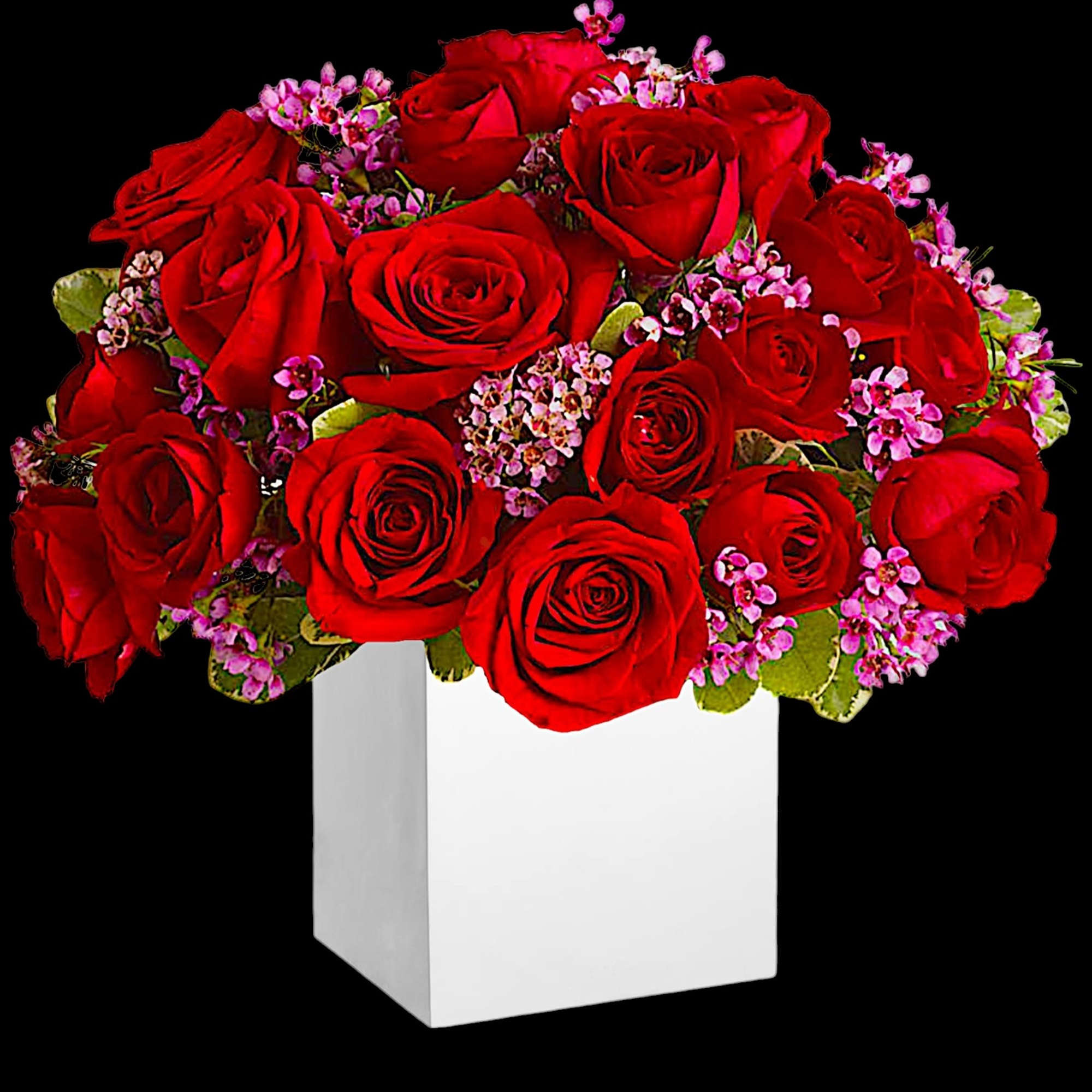 Red roses with small pink filler flowers in a white box vase
