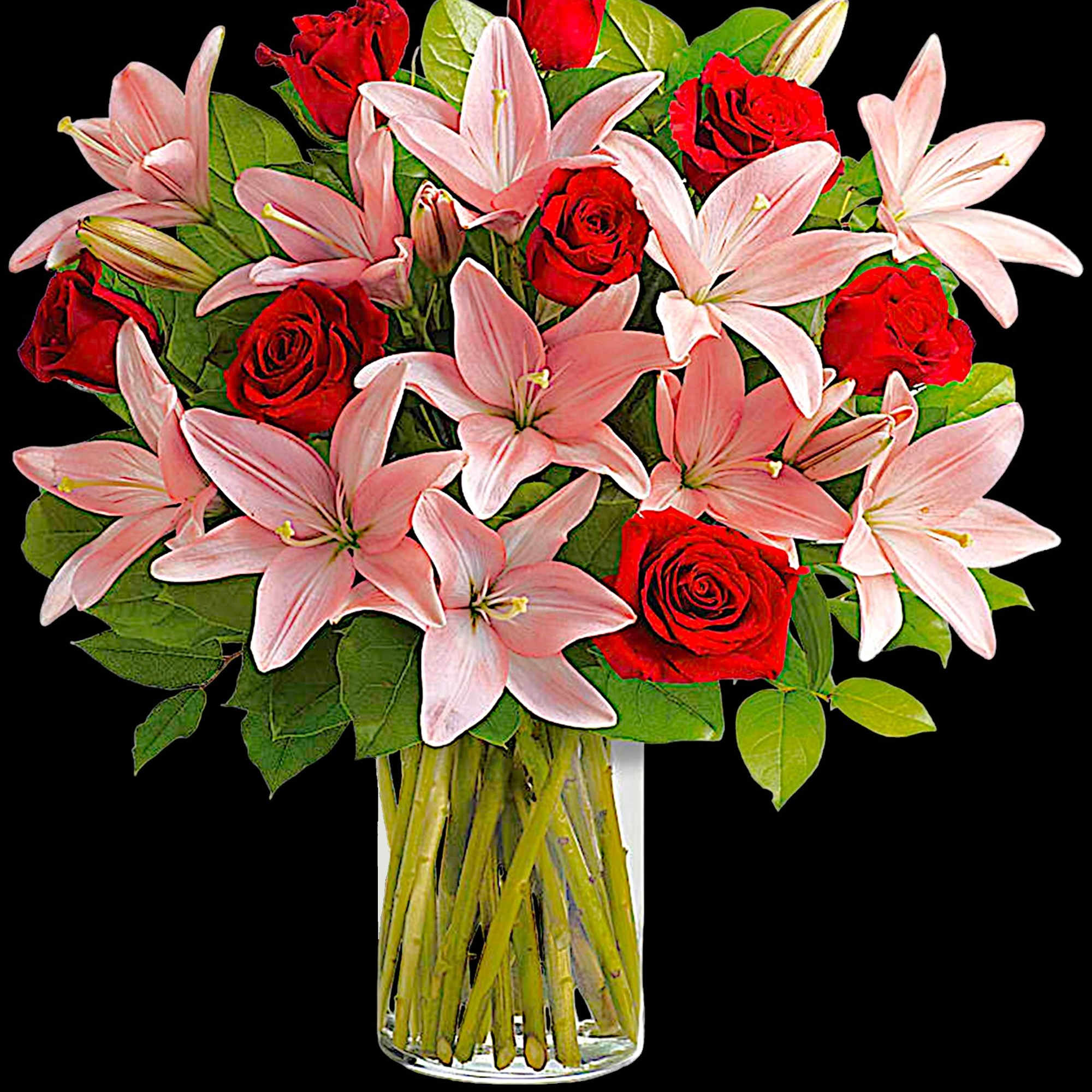 Pink lilies and red roses in a clear glass vase