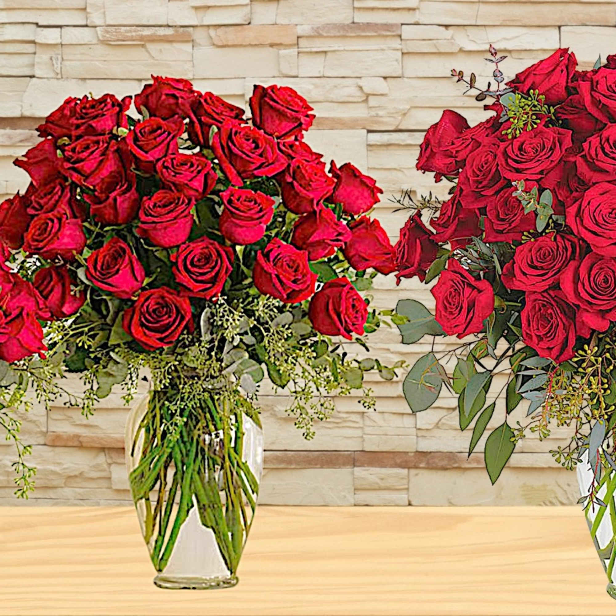 Three bouquets of red roses in clear glass vases