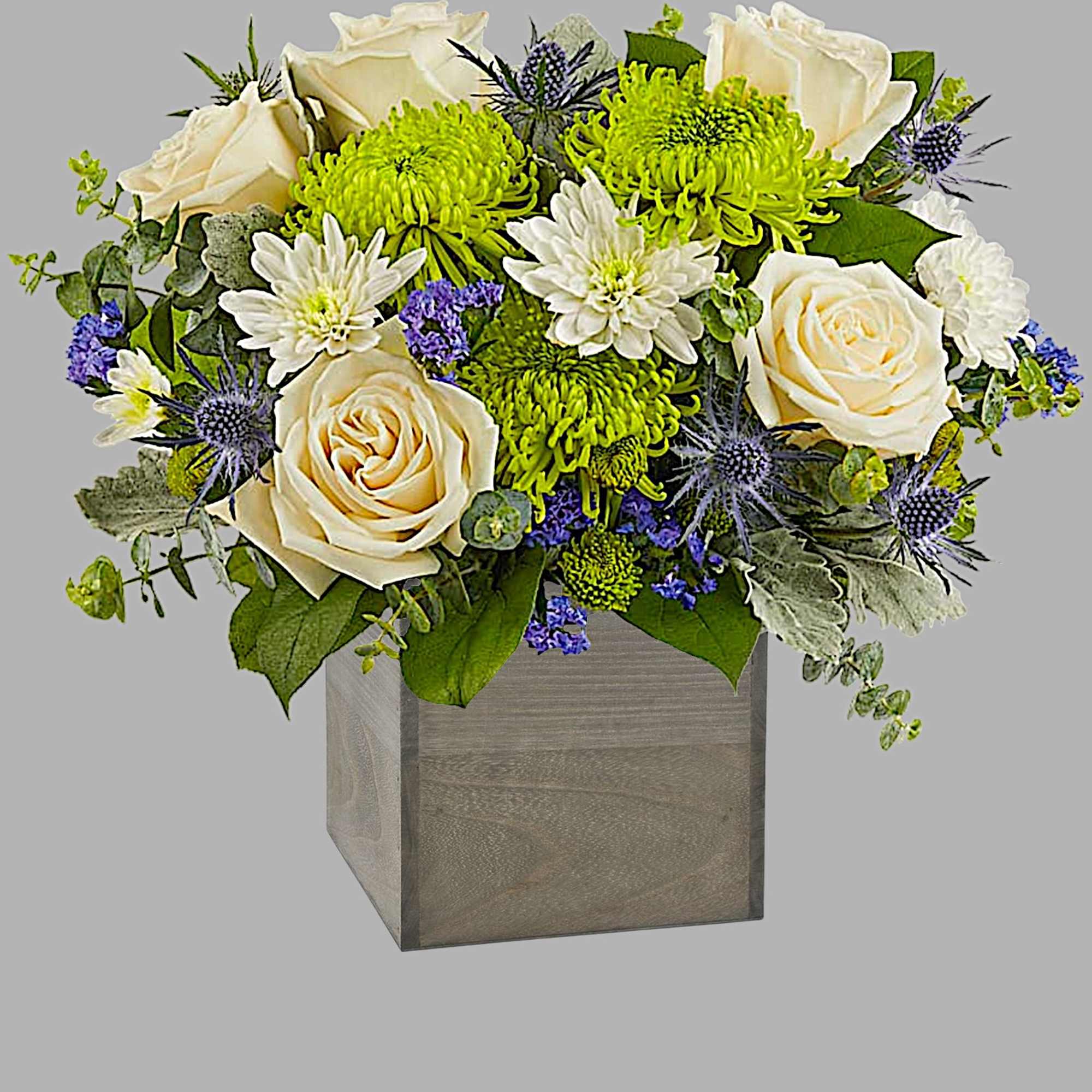 Cream roses and green chrysanthemums in a wooden cube vase