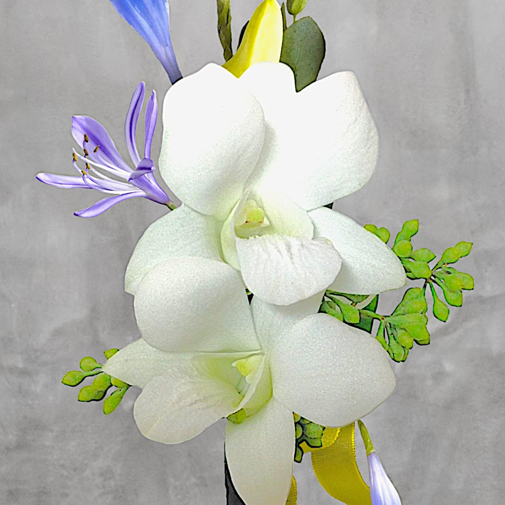 White orchid bouquet with purple and yellow accents