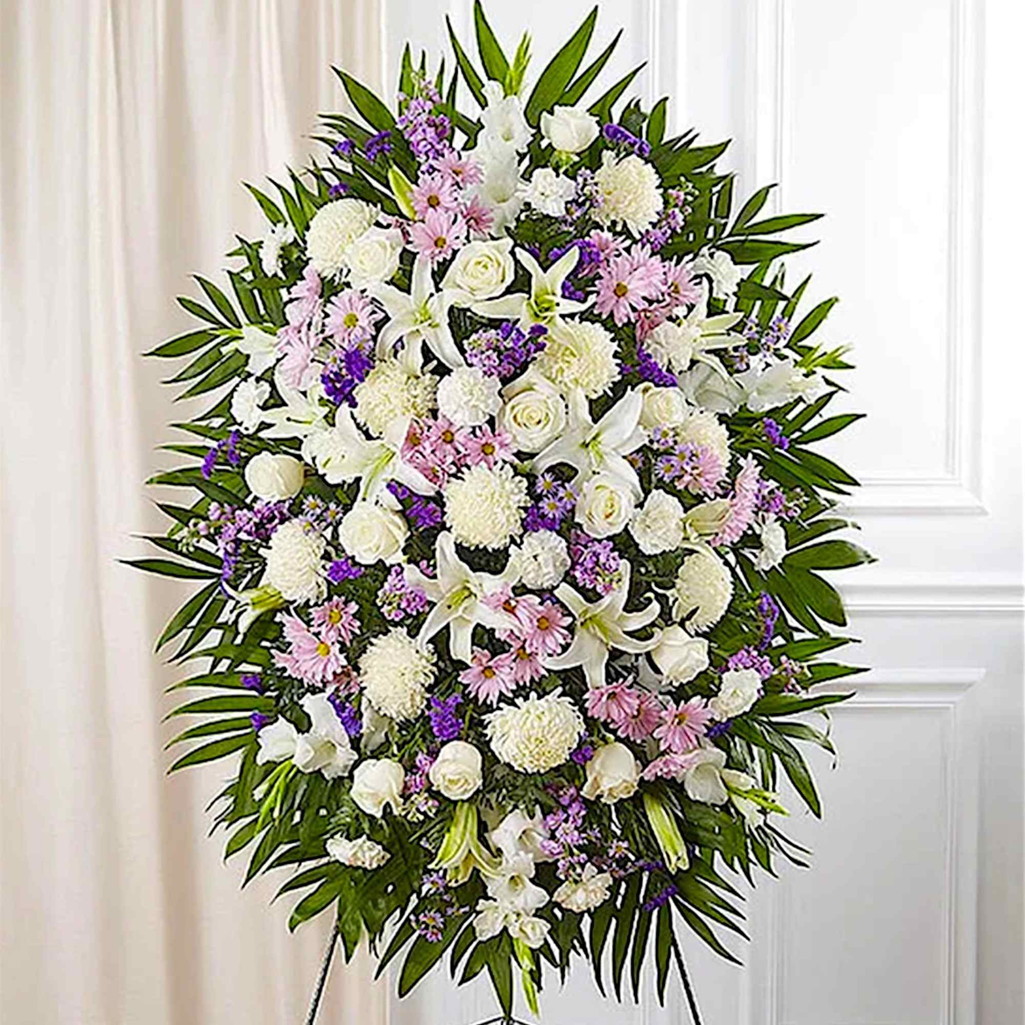 Standing floral wreath with white, pink, and purple flowers
