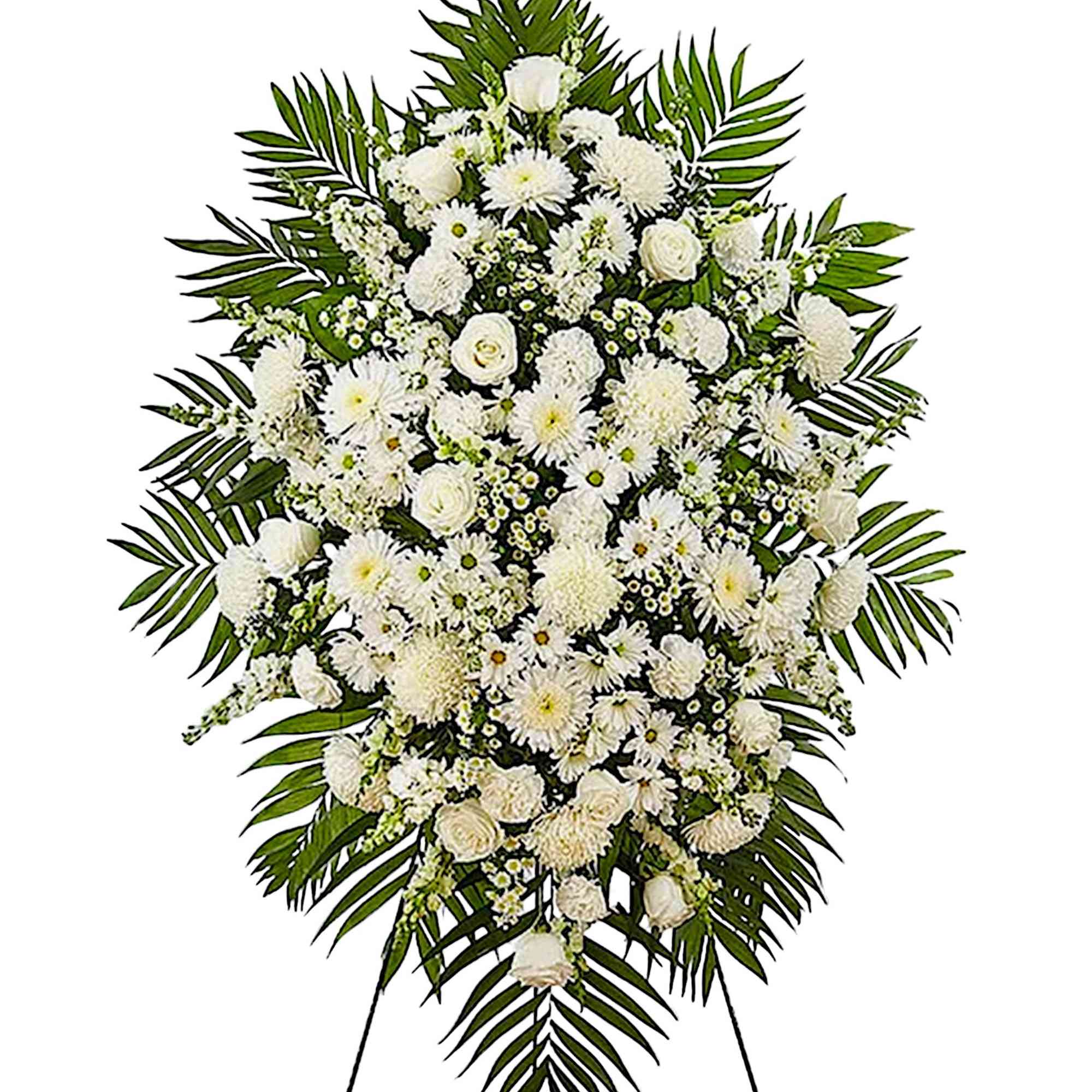 White funeral spray with mixed flowers and palm fronds