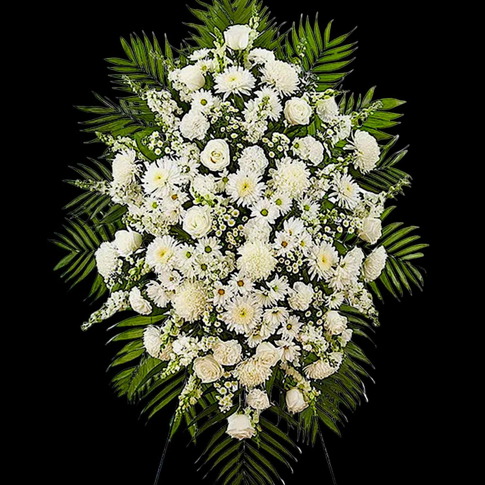 Large white funeral spray with mixed blooms and palm fronds