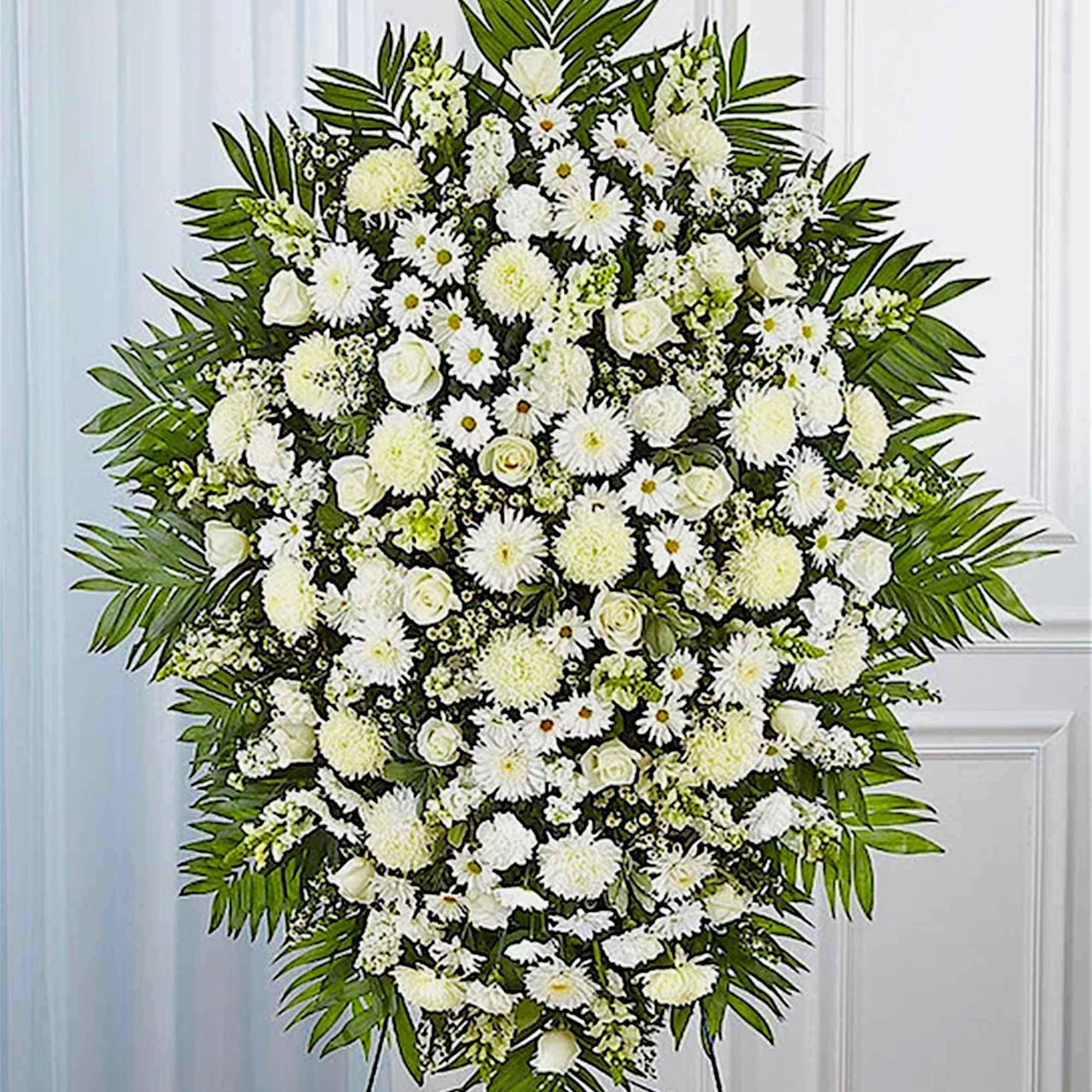 Large white funeral spray with daisies and roses on a stand, photo 3 of 6