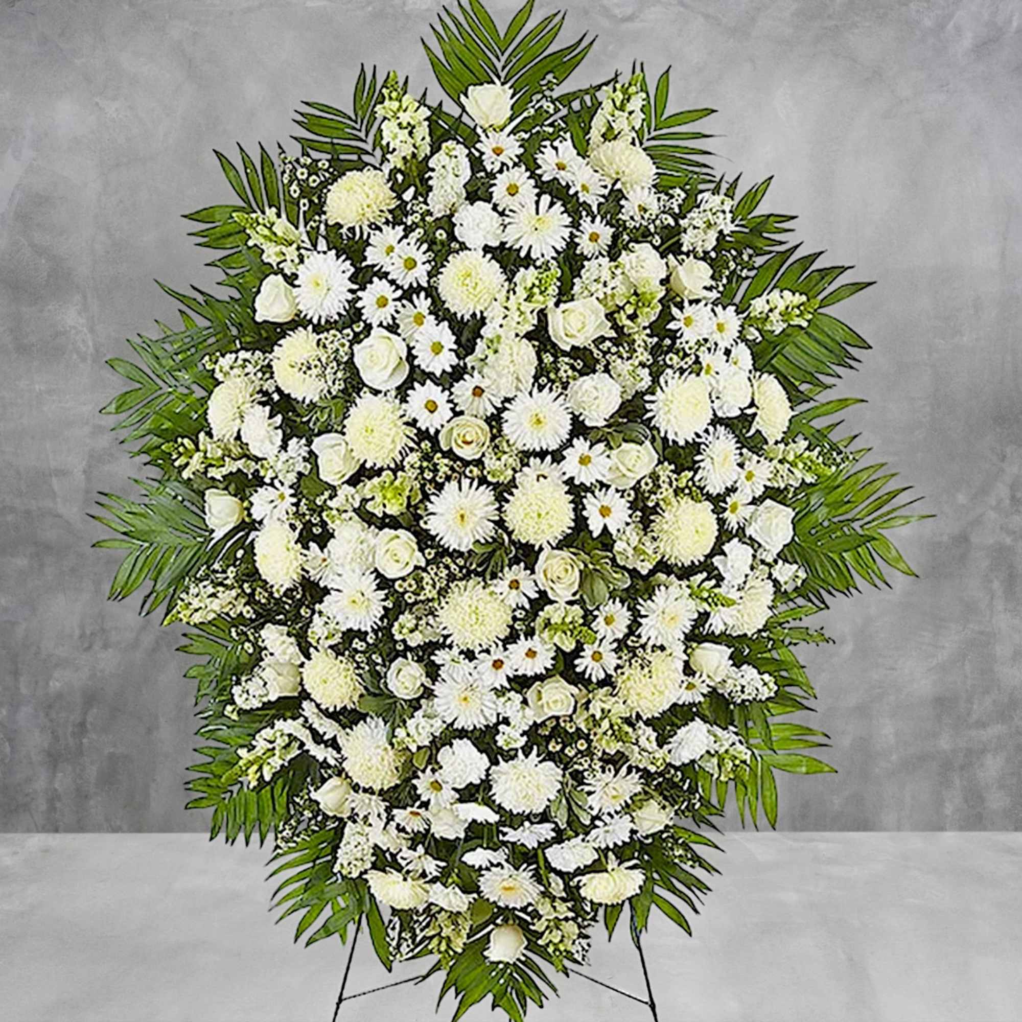 Large white funeral spray with daisies and roses on a stand, photo 4 of 6