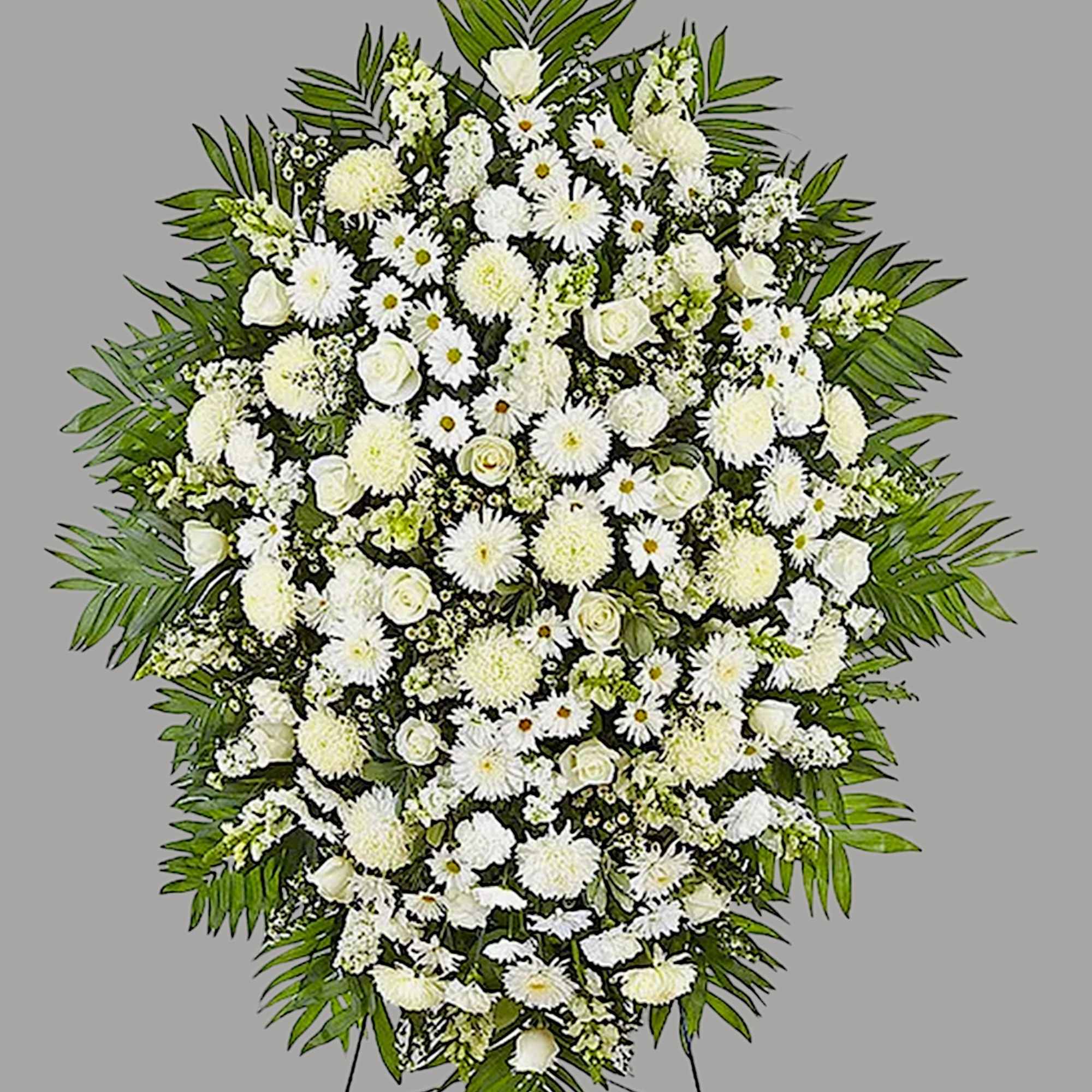 Large white funeral spray with daisies, roses, and chrysanthemums