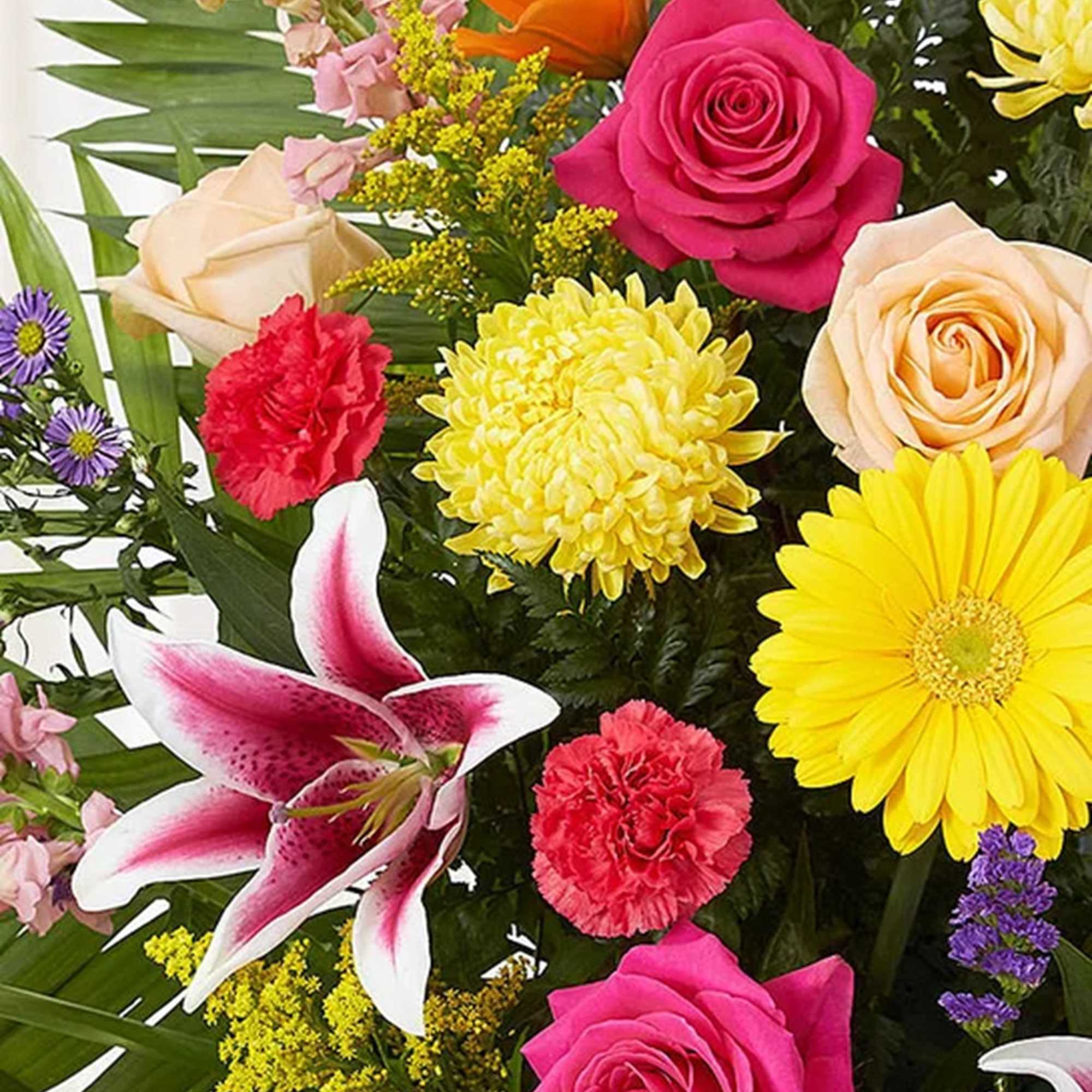 Mixed bouquet with roses, lilies, daisies, and carnations