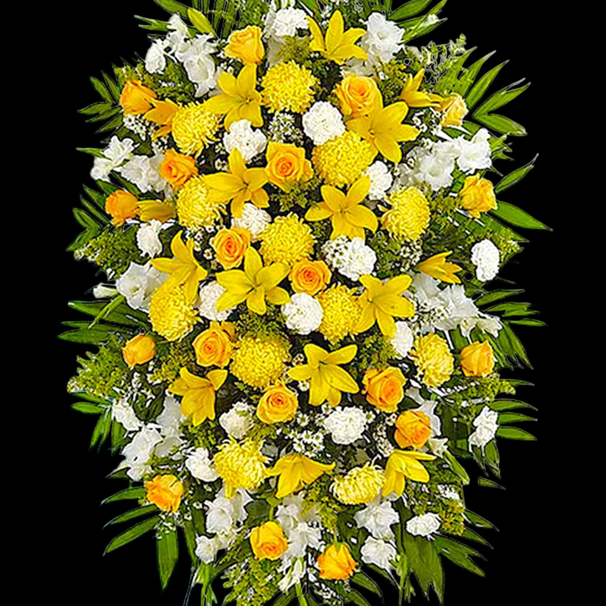 Yellow and white funeral spray with roses and lilies on a stand
