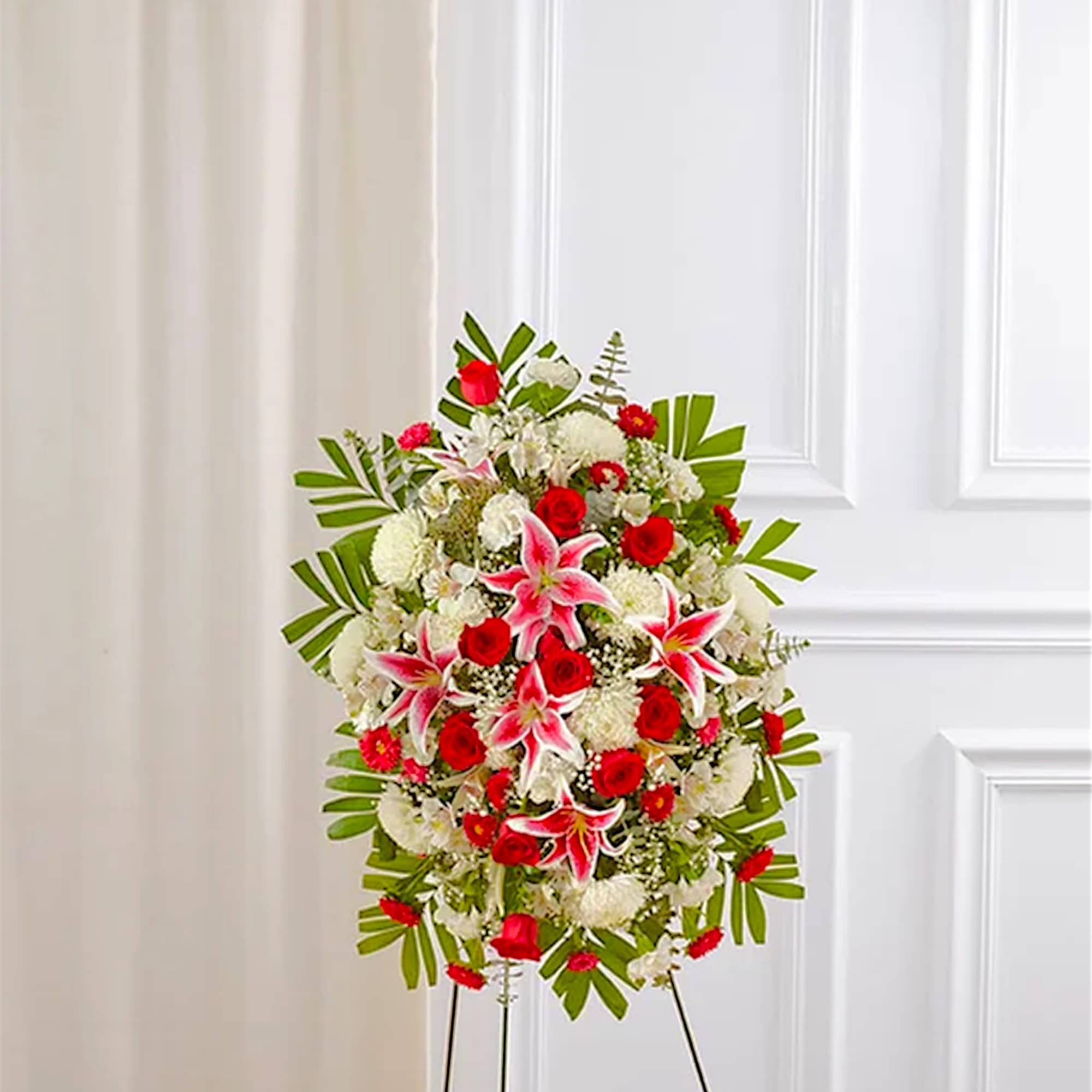 Standing floral spray with red roses, pink lilies, and white blooms, photo 3 of 6