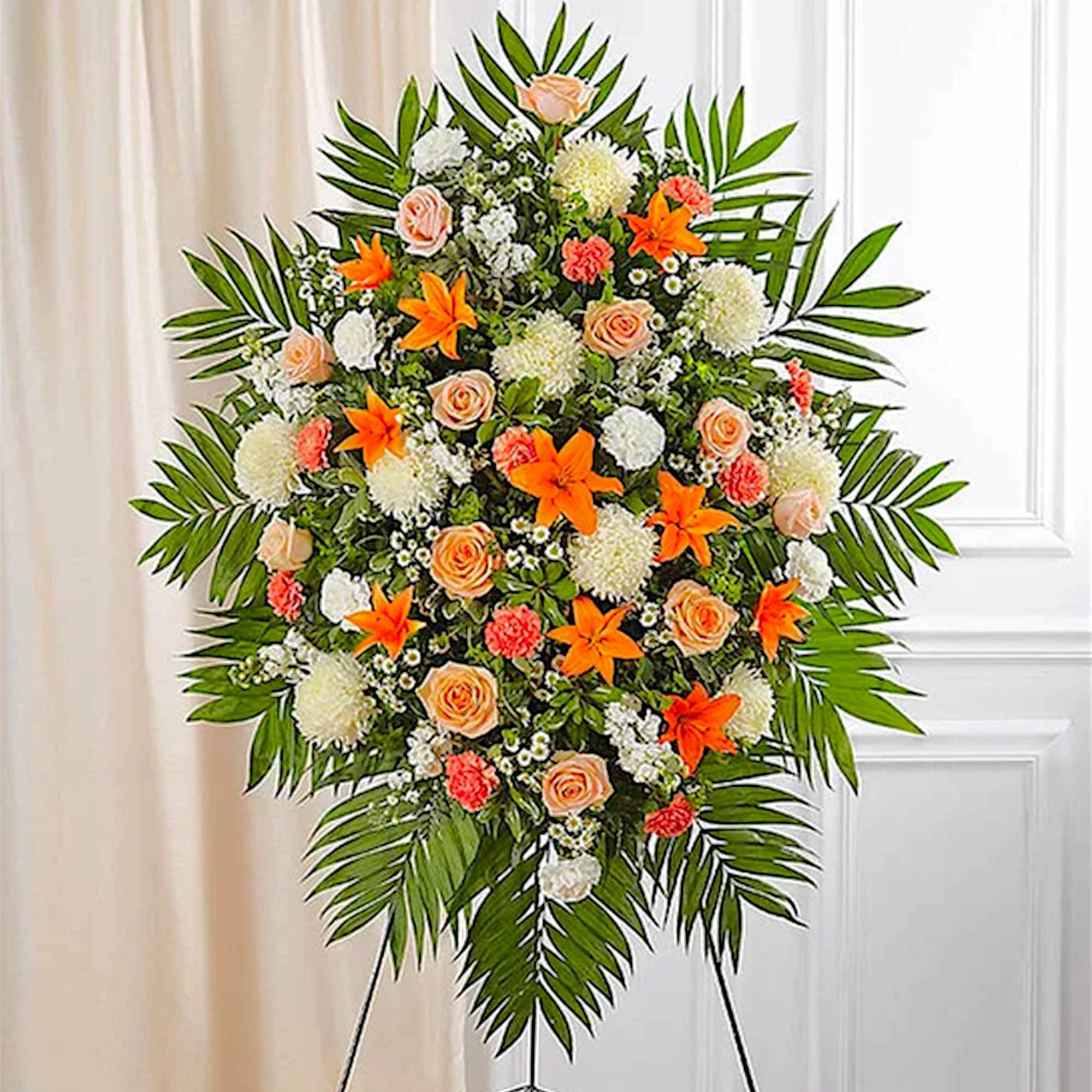 Standing floral spray with orange lilies, peach roses, and white blooms, photo 2 of 5