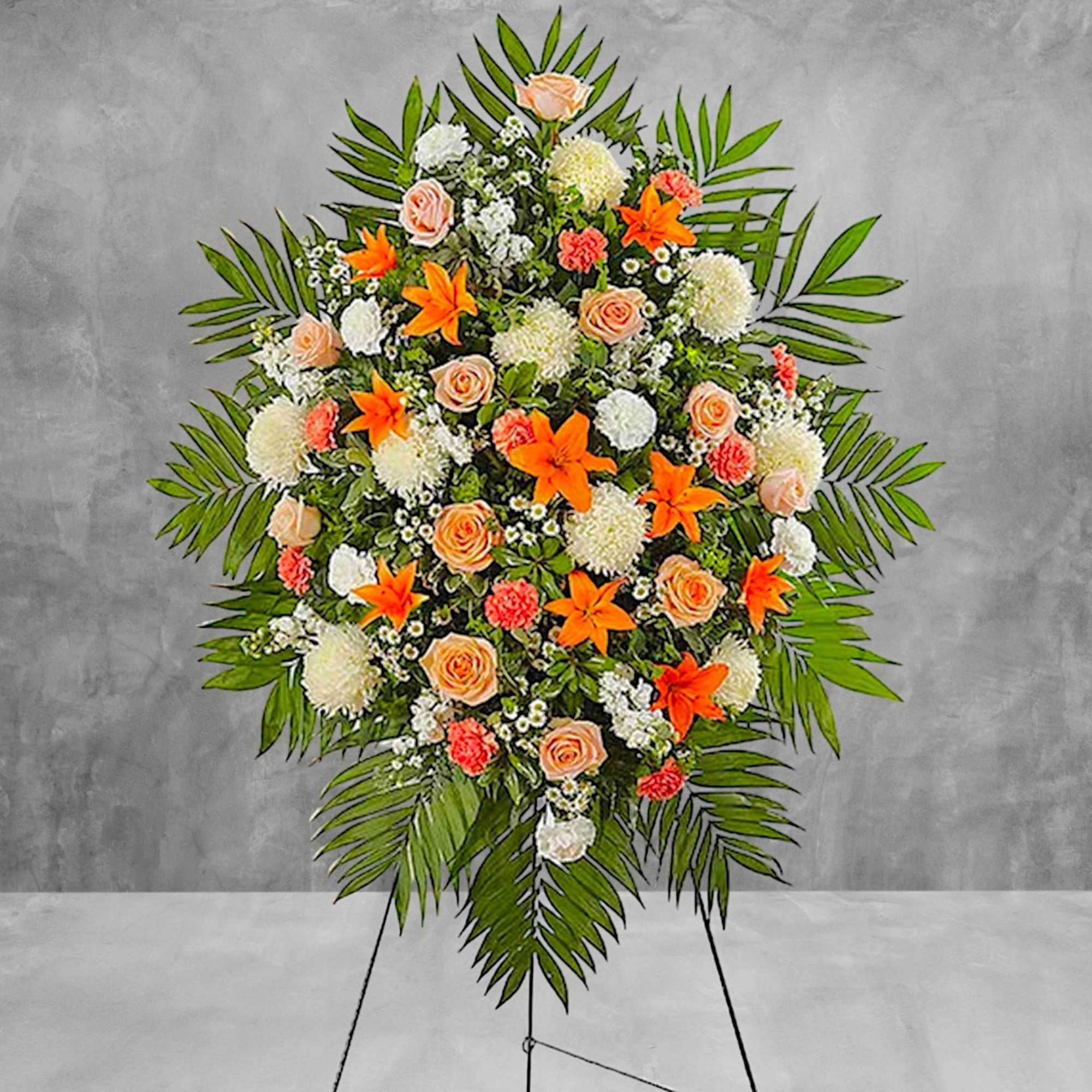 Standing floral spray with orange lilies, peach roses, and white blooms, photo 3 of 5